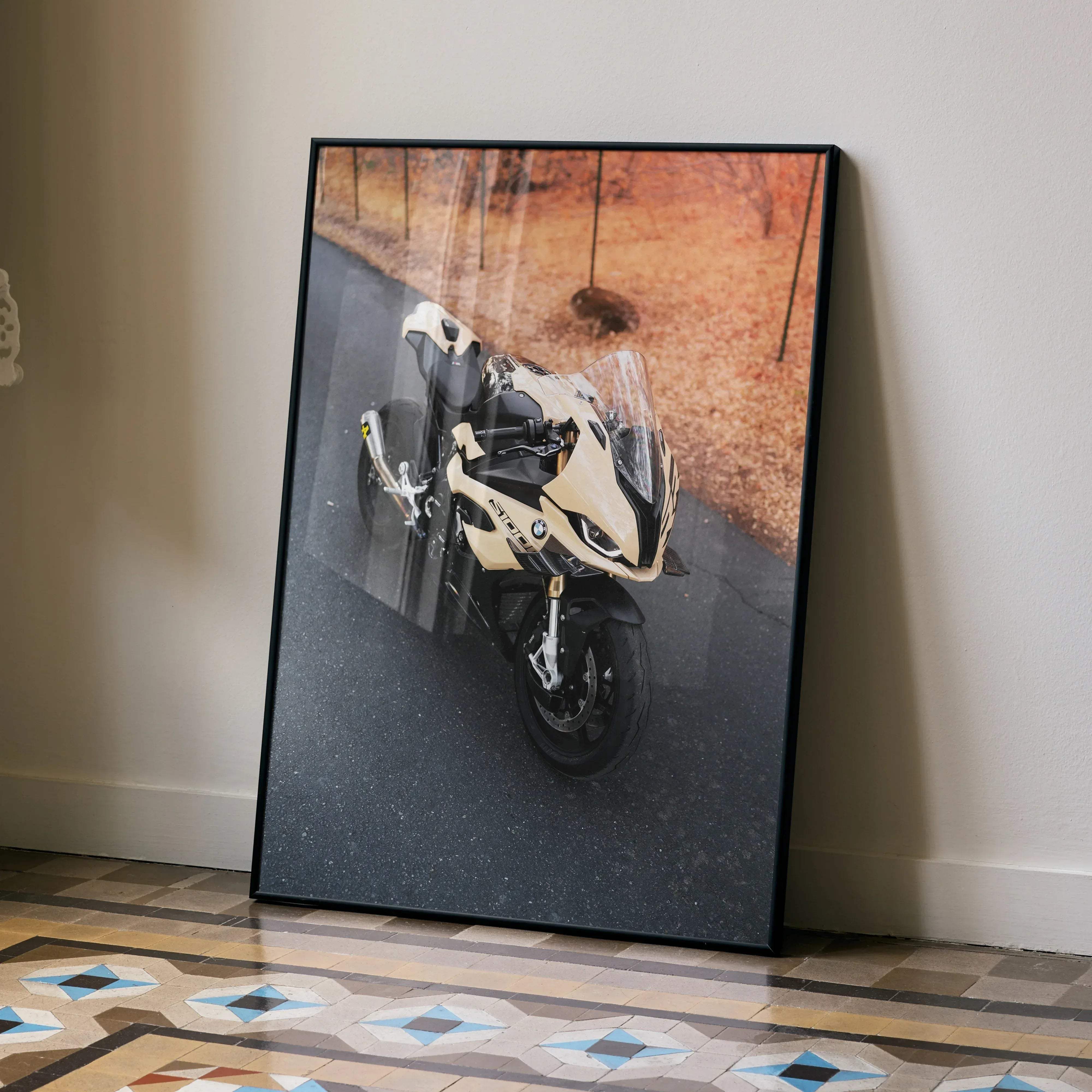 Black-framed poster featuring a cream and black bmw s1000rr motorcycle on an asphalt road in high resolution