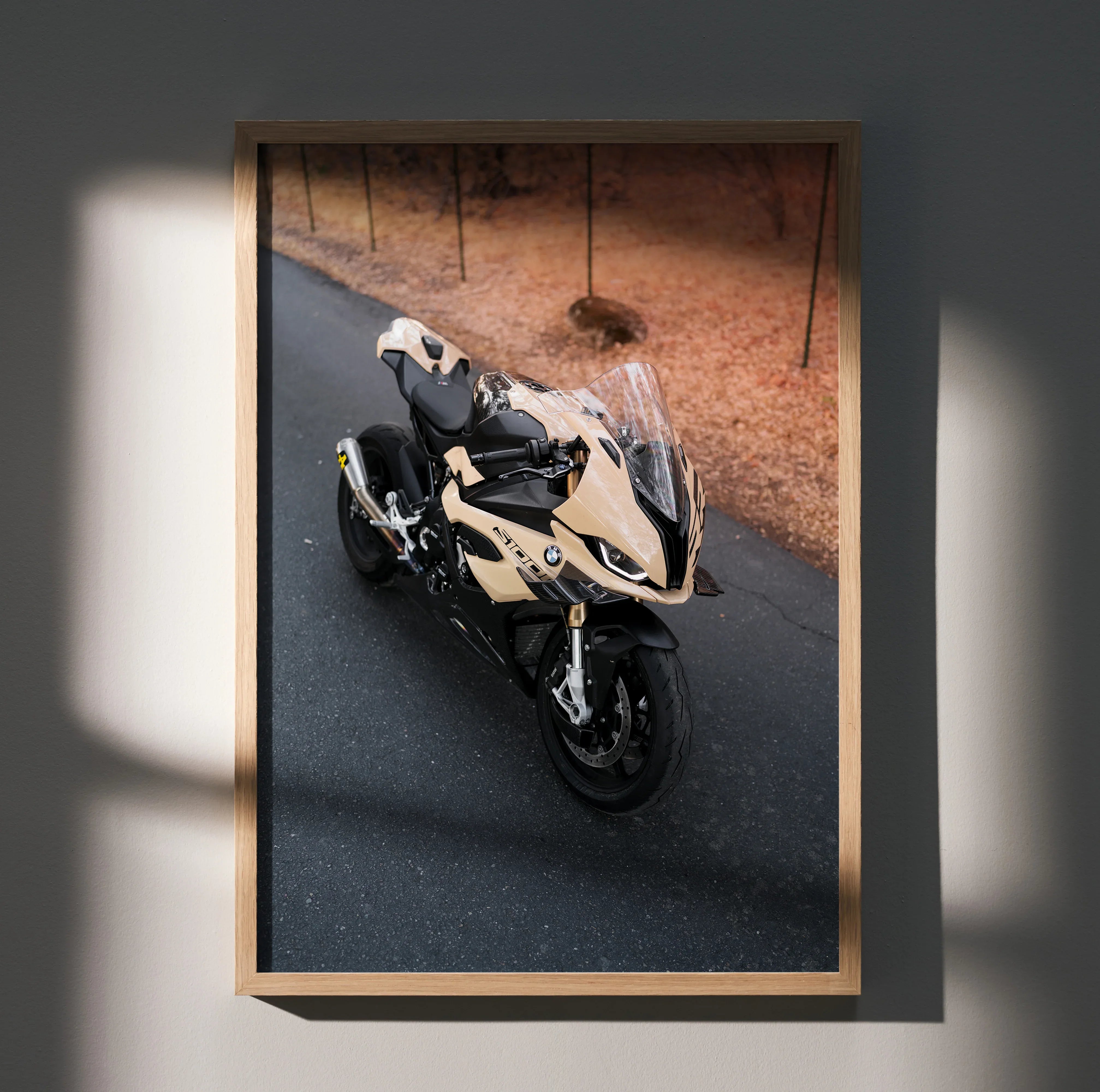 BMW S1000RR motorcycle poster featuring black and white bike on asphalt, wall art with wooden frame.