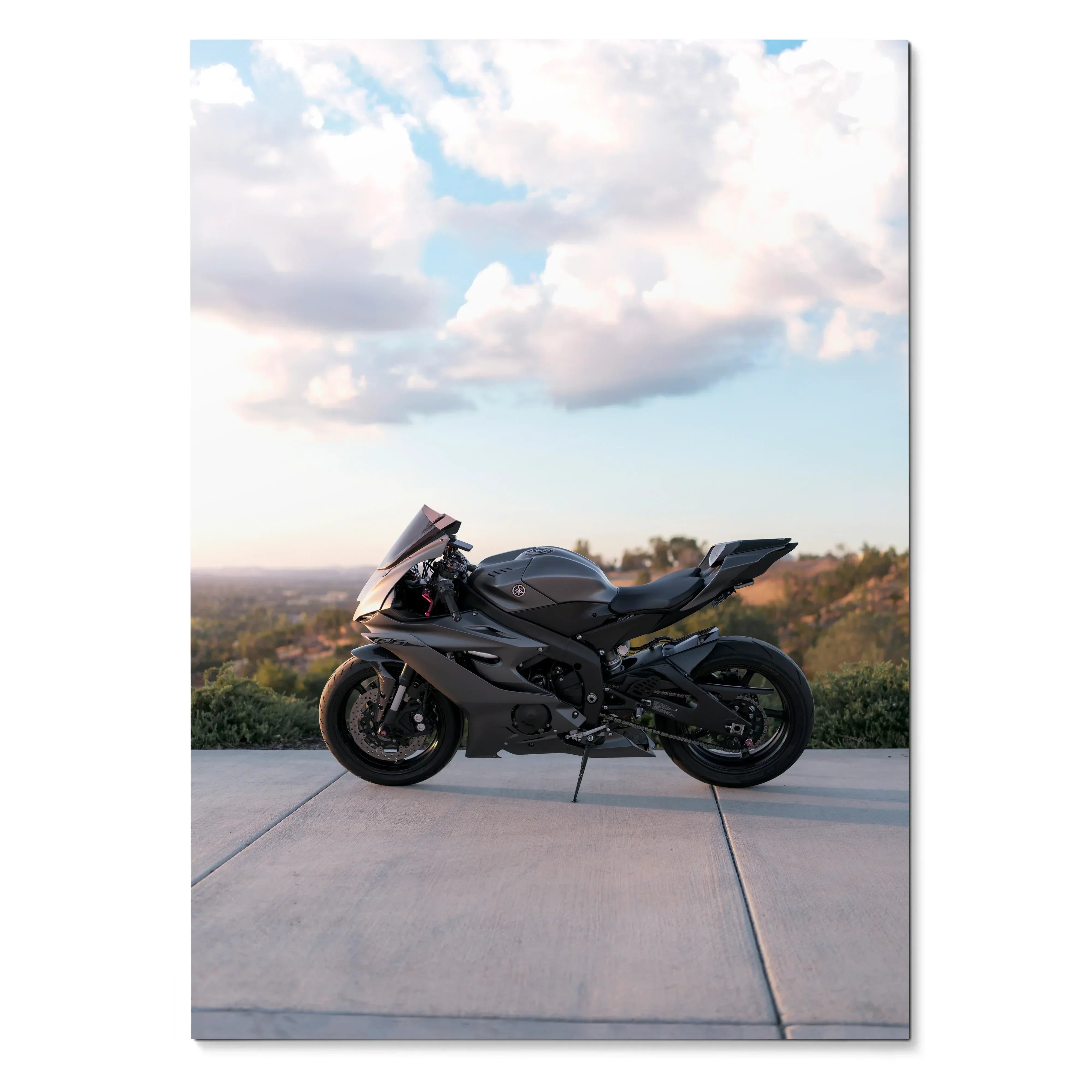 Yamaha R6 motorcycle parked on concrete with scenic sky background poster wall art.