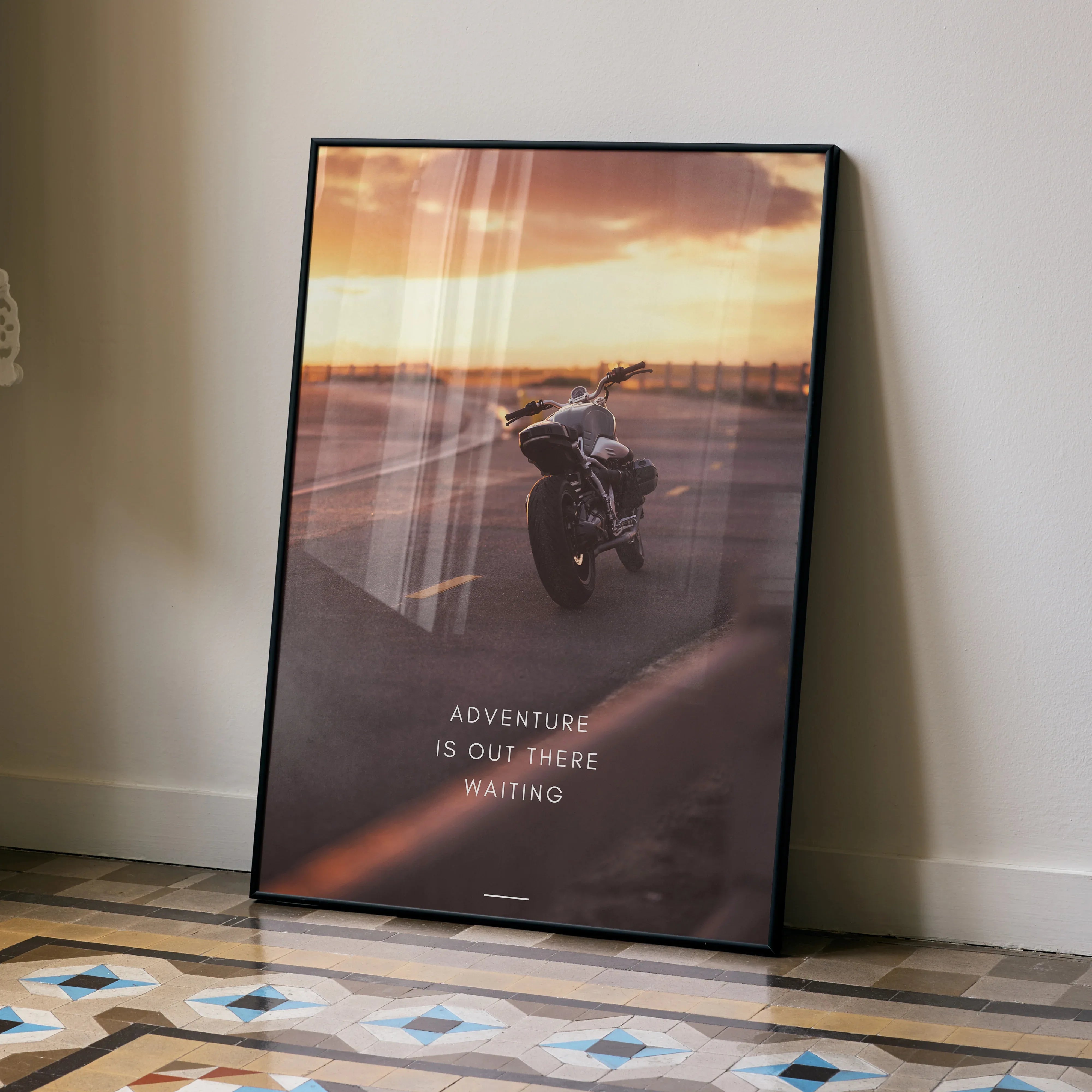 BMW R Nine T motorcycle poster with sunset and motivational text Adventure is out there waiting wall art.