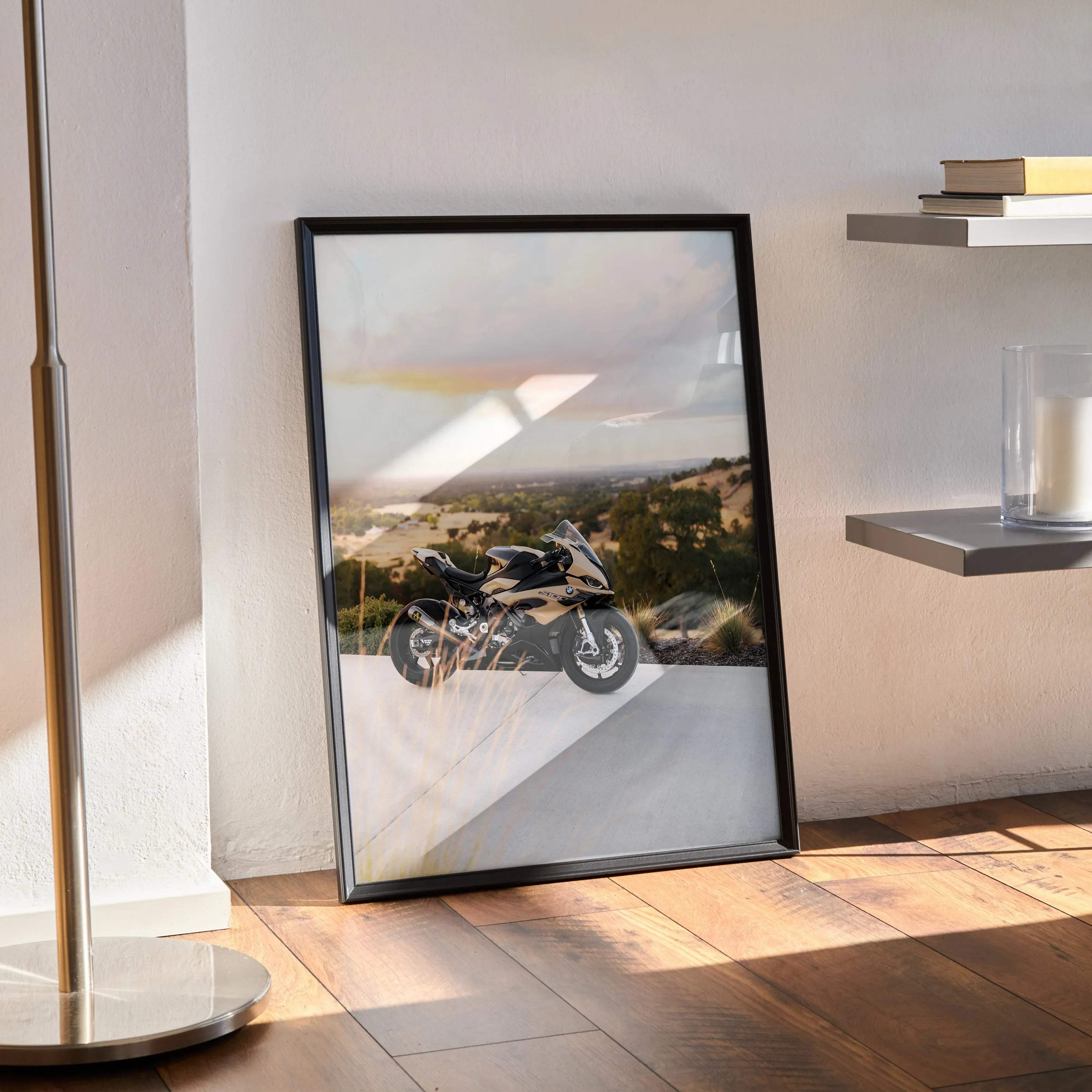 Black-framed poster featuring a sleek black and gold bmw inspired s1000rr motorcycle on a winding road under dramatic sky
