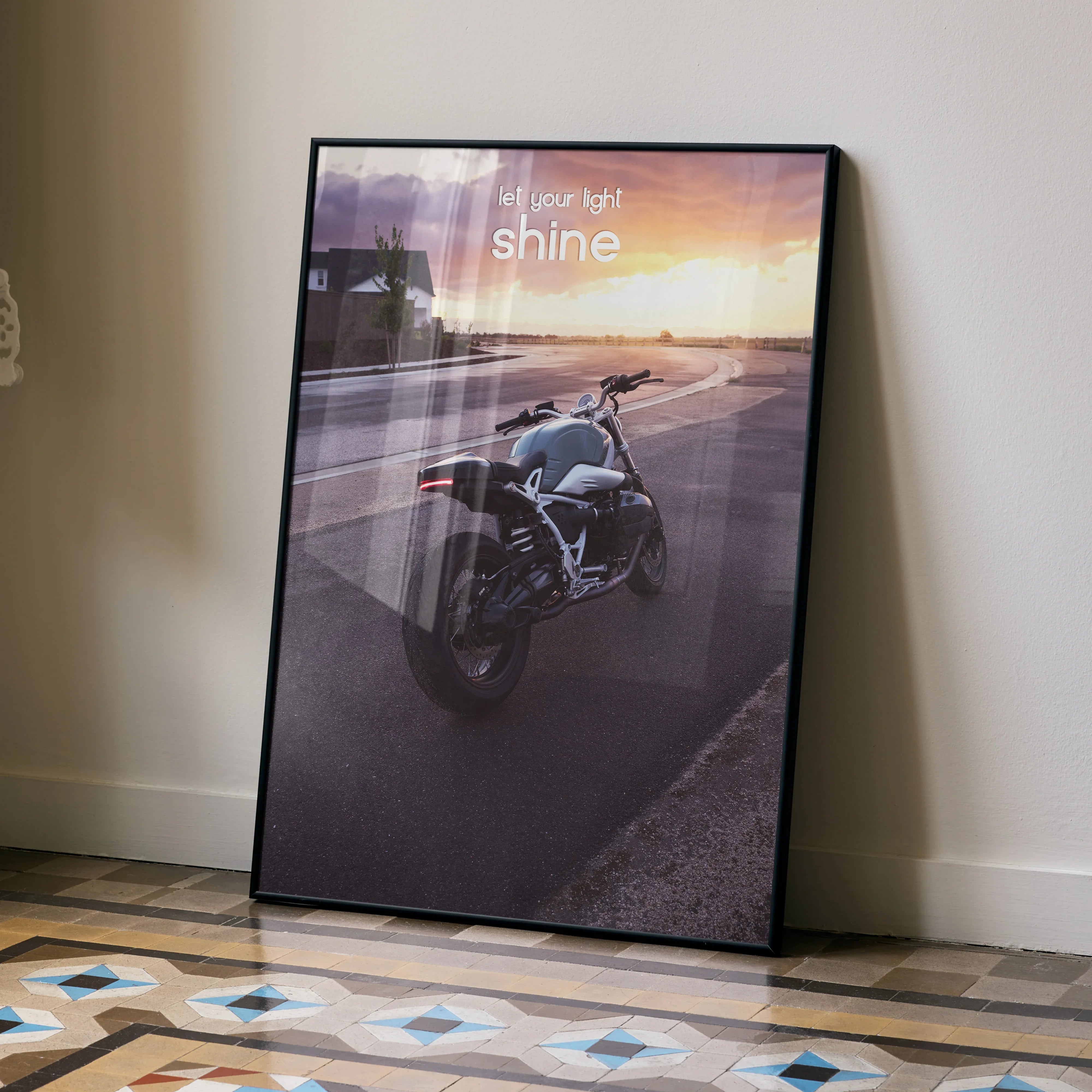 Motivational poster wall art featuring BMW R Nine T motorcycle on a road at sunset with inspiring text.
