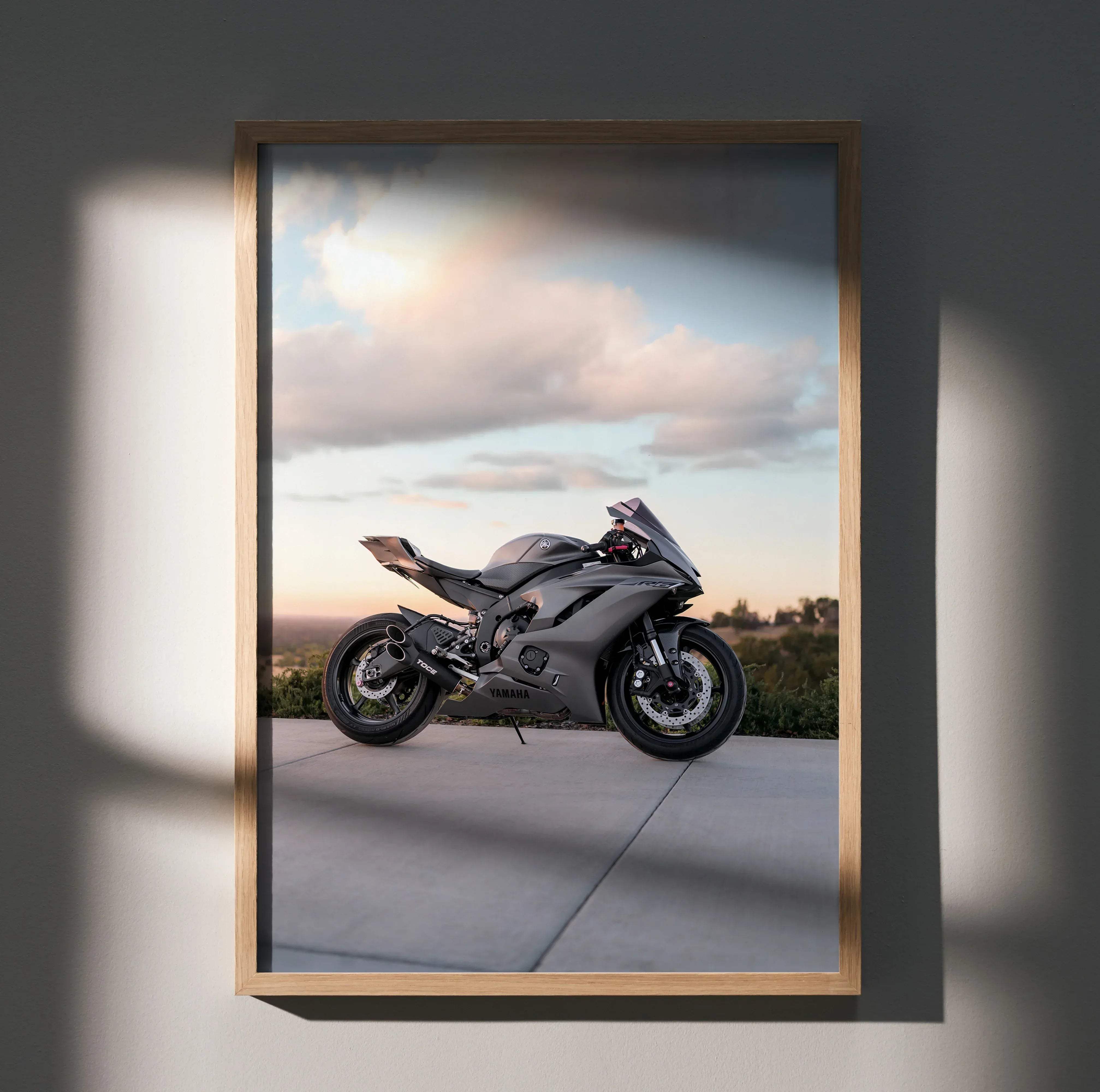 Gray Yamaha R6 sport motorcycle poster in a light wood frame suitable for wall decoration
