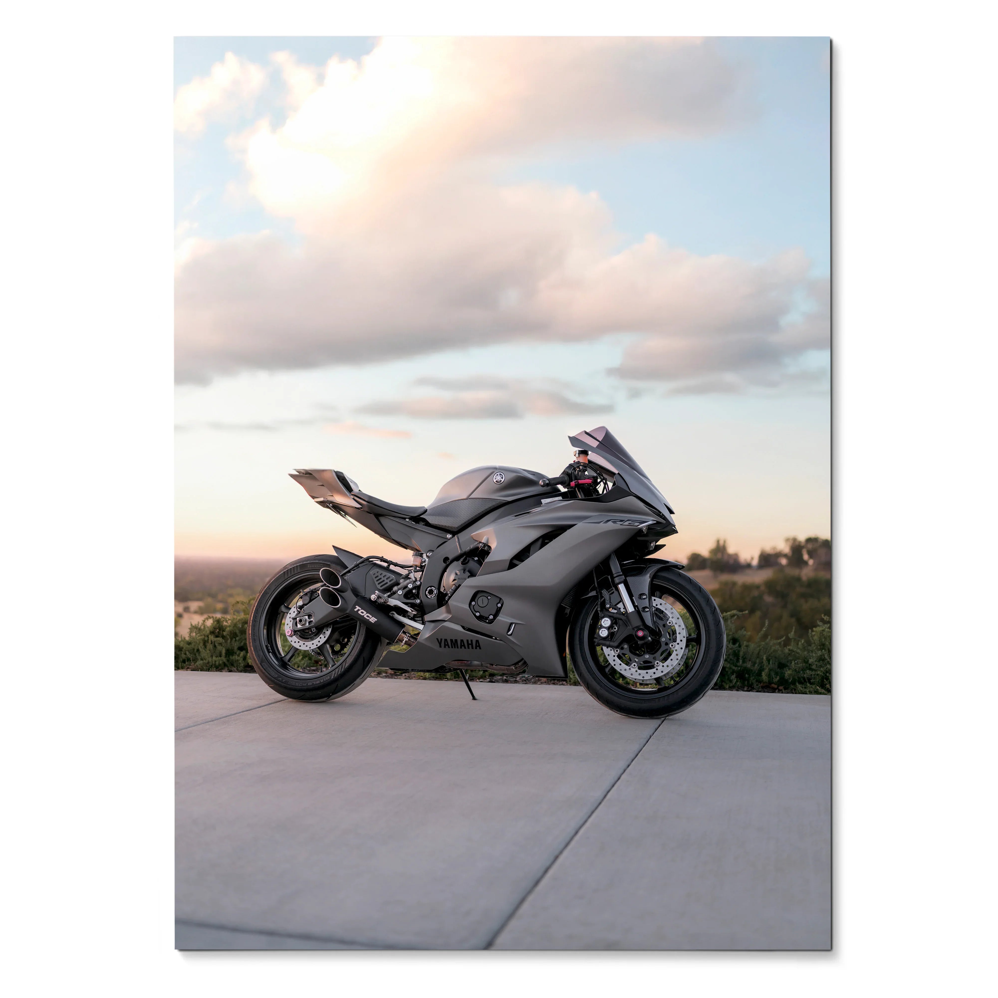 Yamaha R6 sport motorcycle parked on concrete at sunset poster wall art.