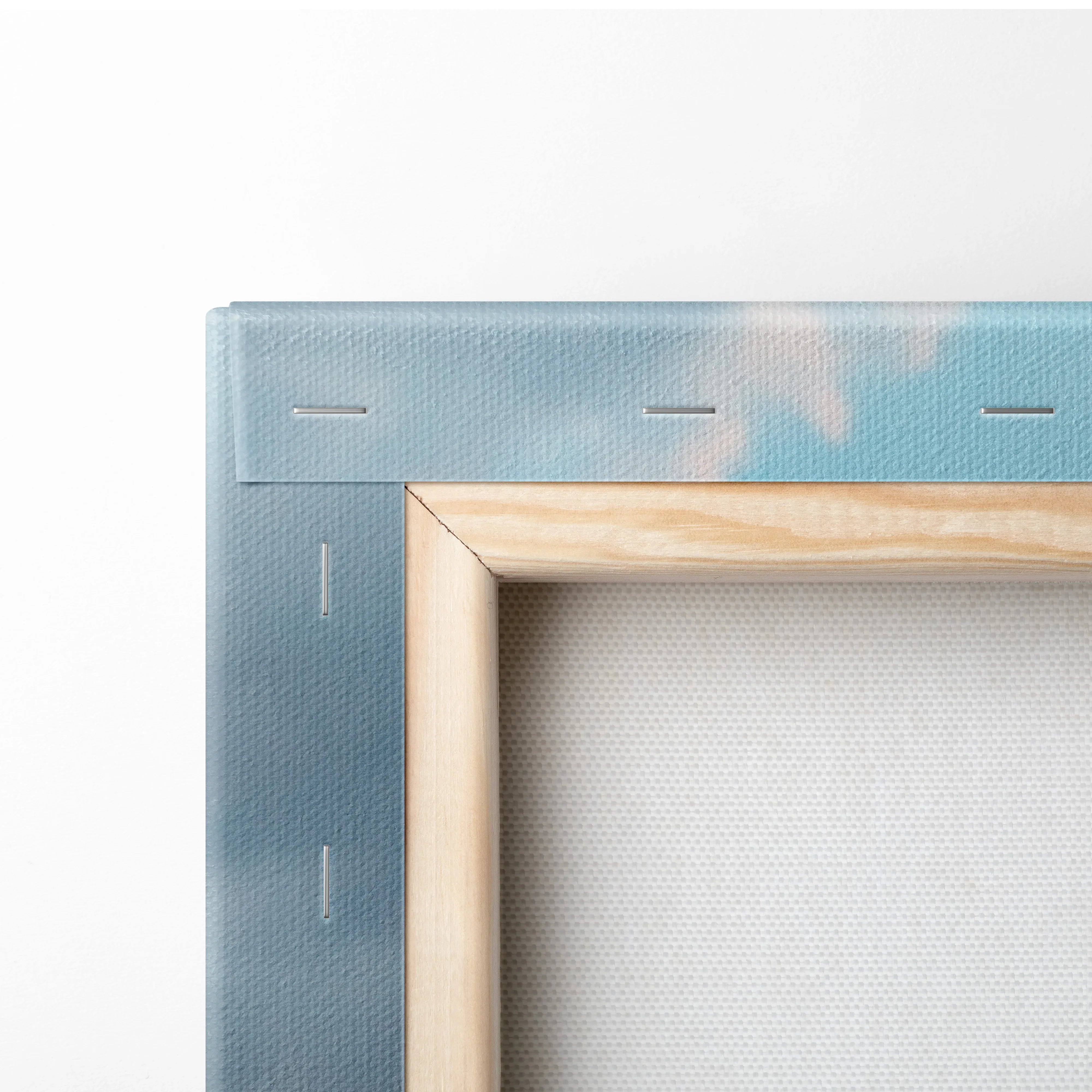 Corner view of Yamaha R6 motorcycle canvas art with wooden stretcher frame showing canvas texture and blue sky design.