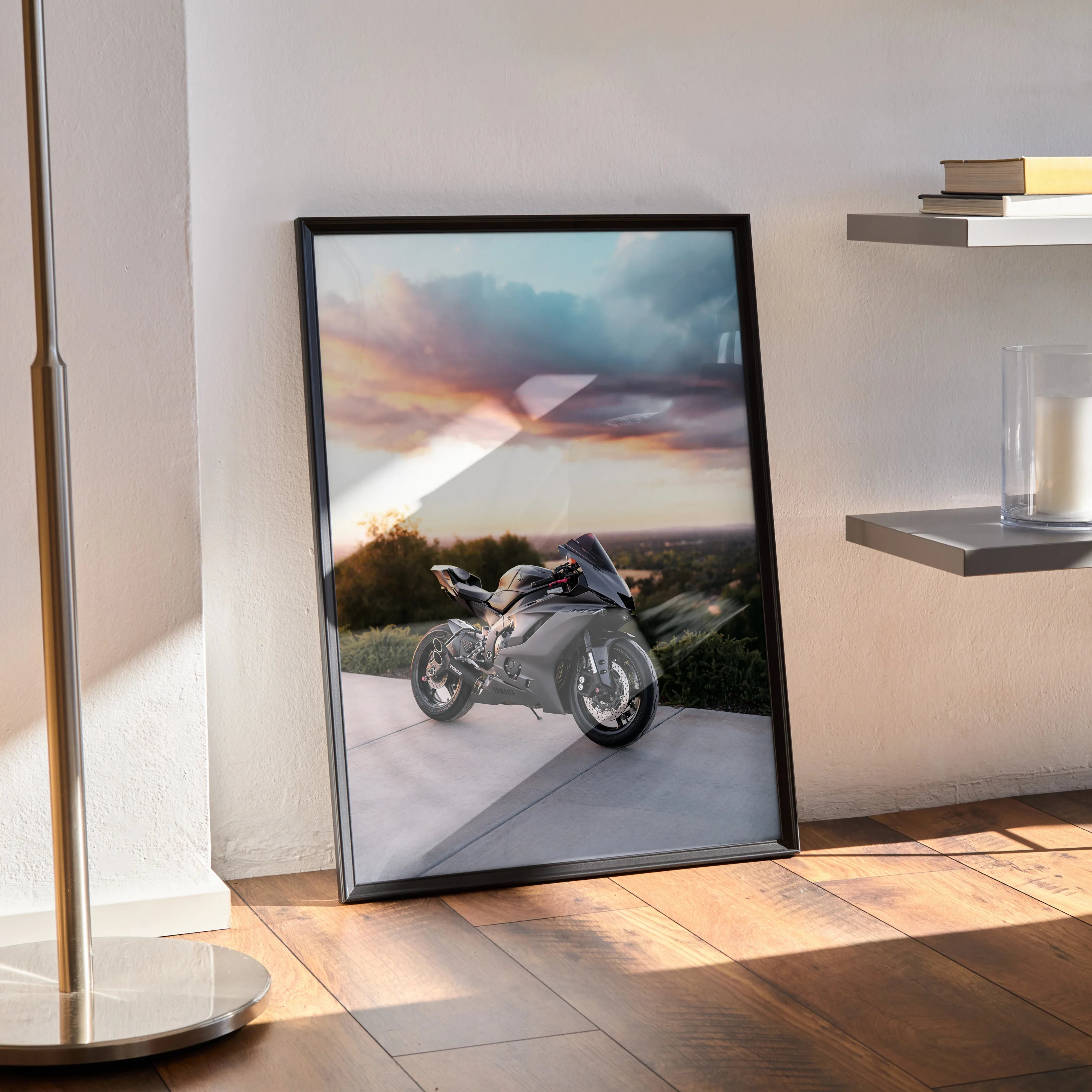 Yamaha R6 motorcycle poster wall art with sunset background in black frame on wooden floor.