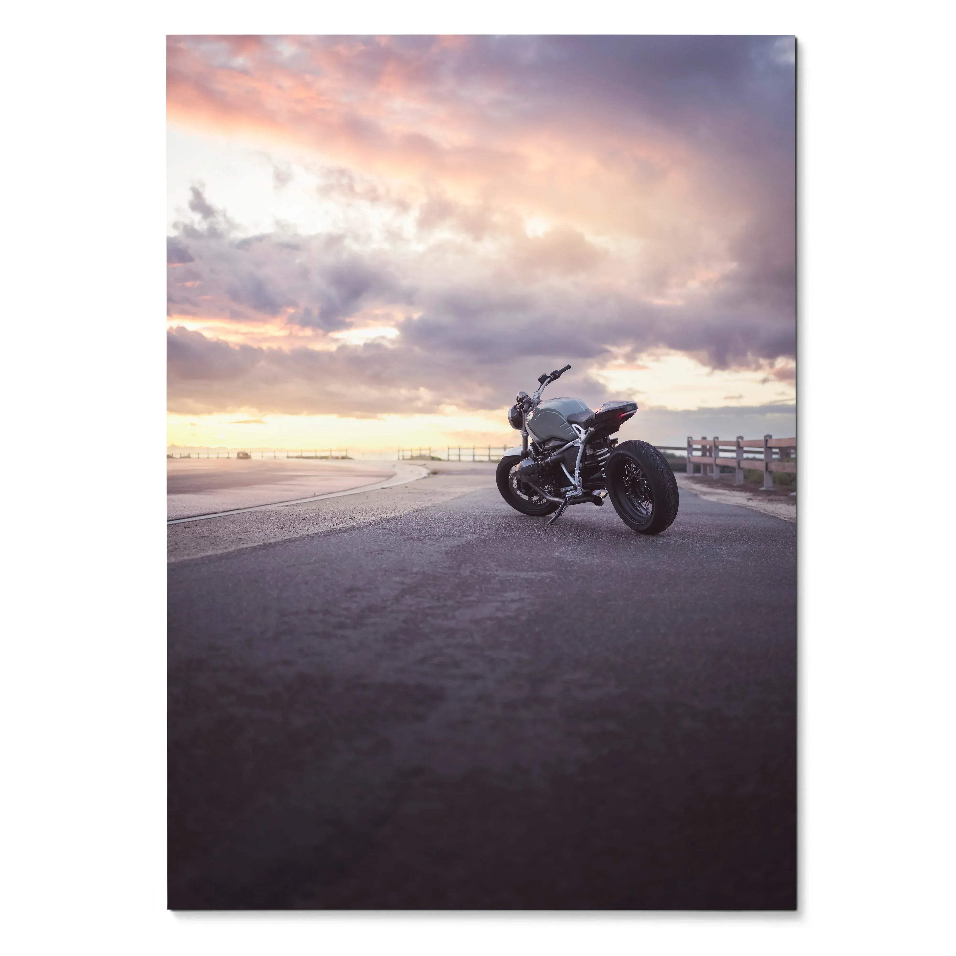 BMW R Nine T motorcycle parked on road at sunset poster wall art with dramatic sky.