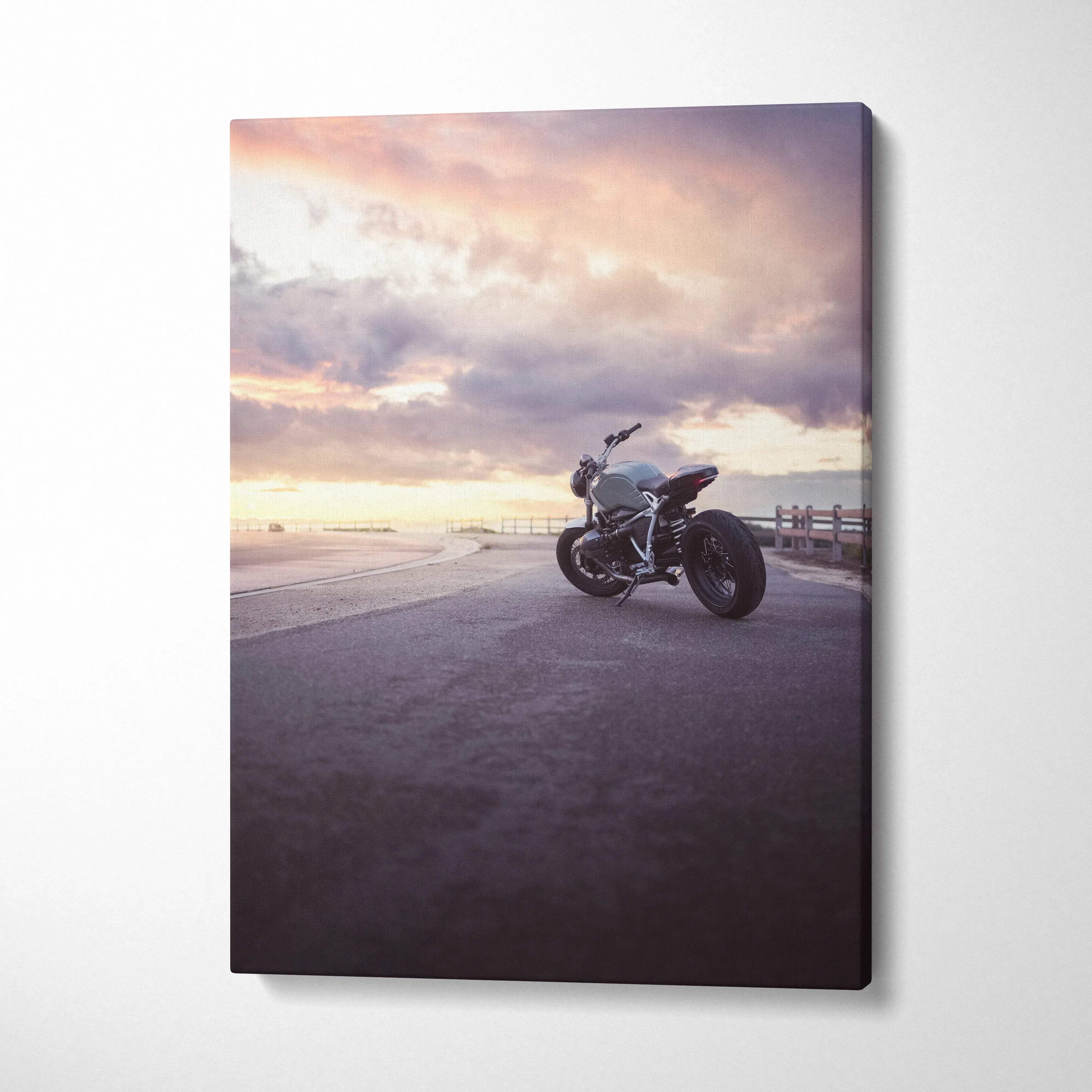 BMW R Nine T motorcycle photographed at sunset on canvas wall art with soft pastel sky background.
