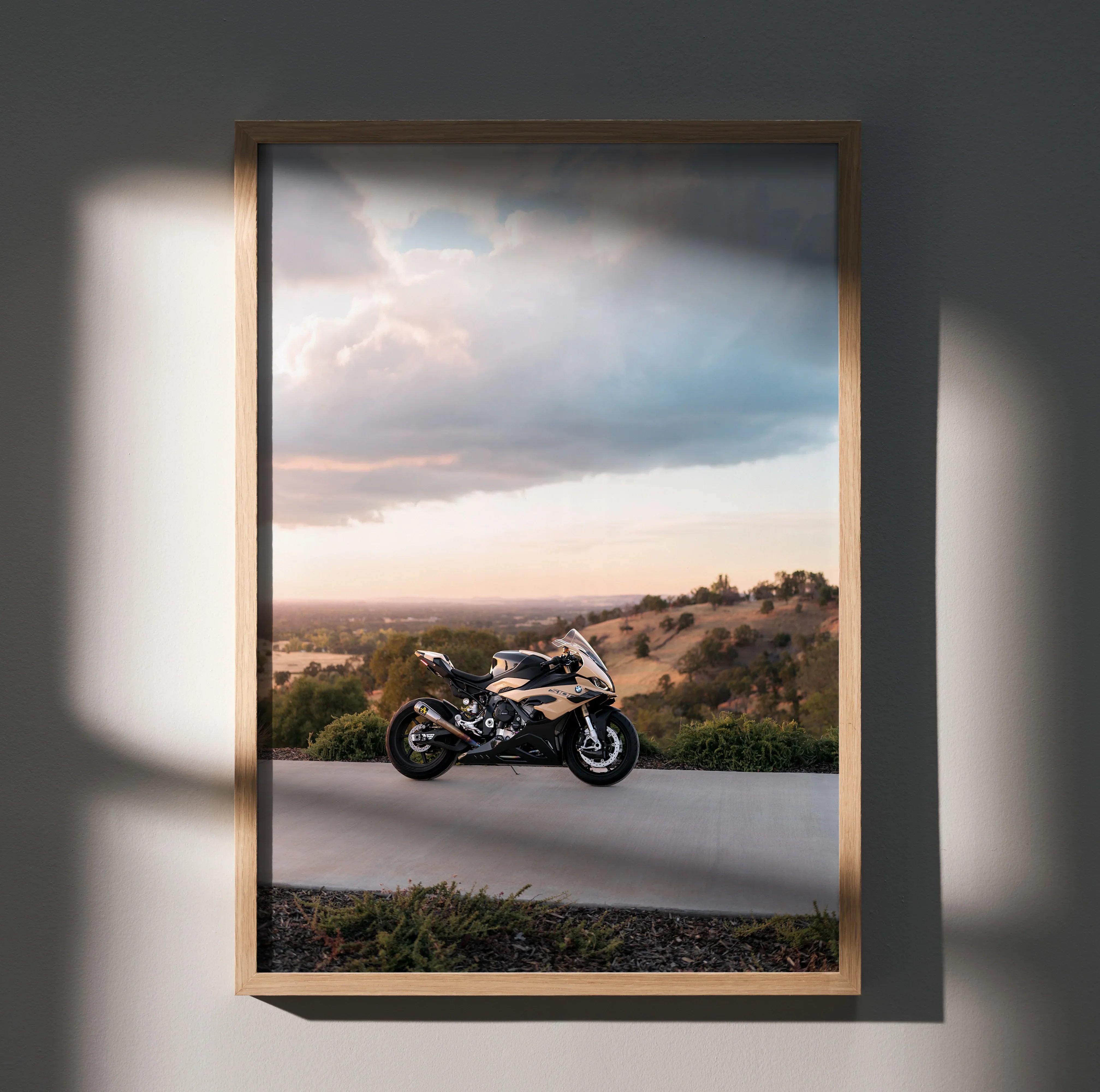 BMW S1000RR motorcycle on road at sunset poster wall art in wooden frame.