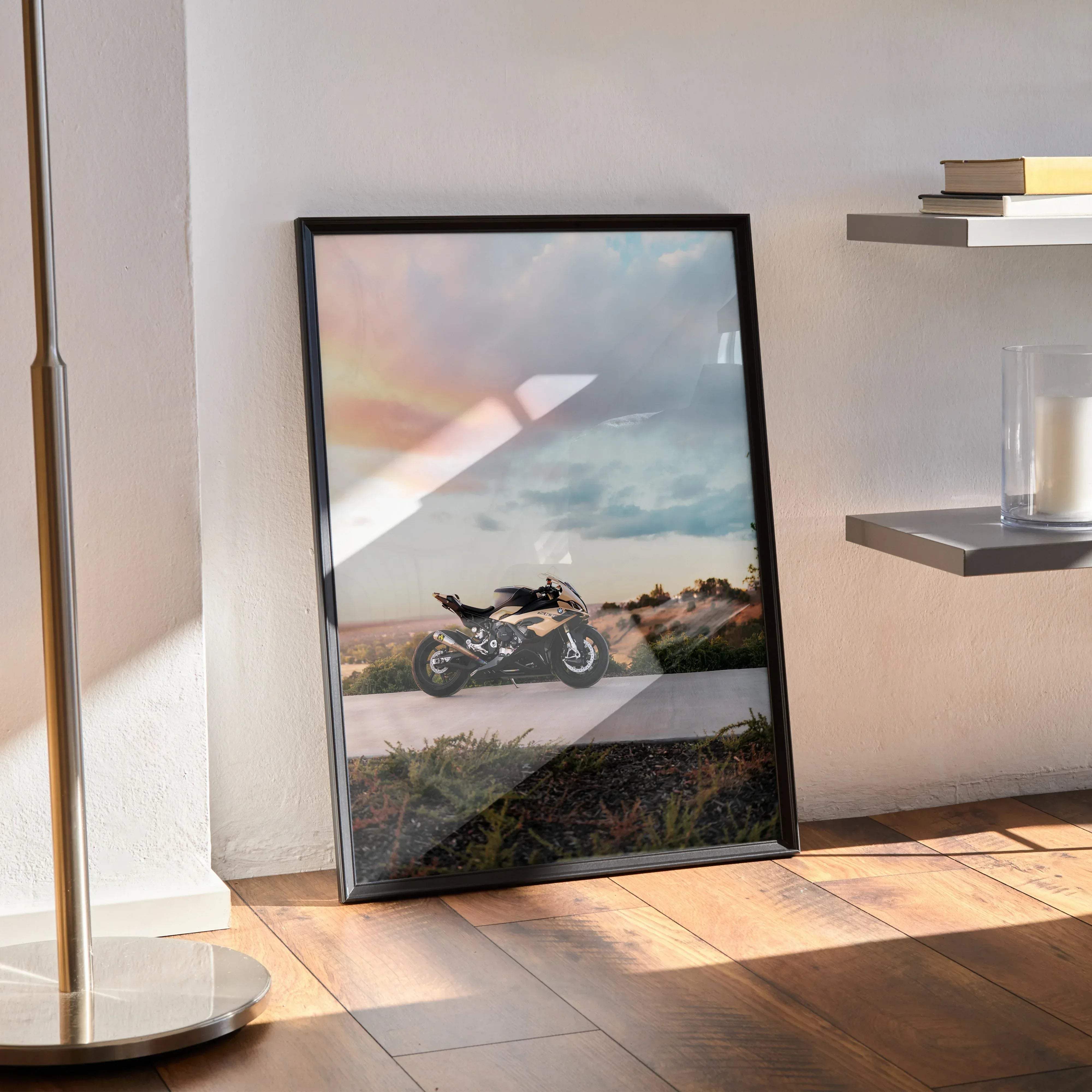 Black-framed poster featuring a sleek black and silver bmw inspired s1000rr motorcycle under a warm sunset sky