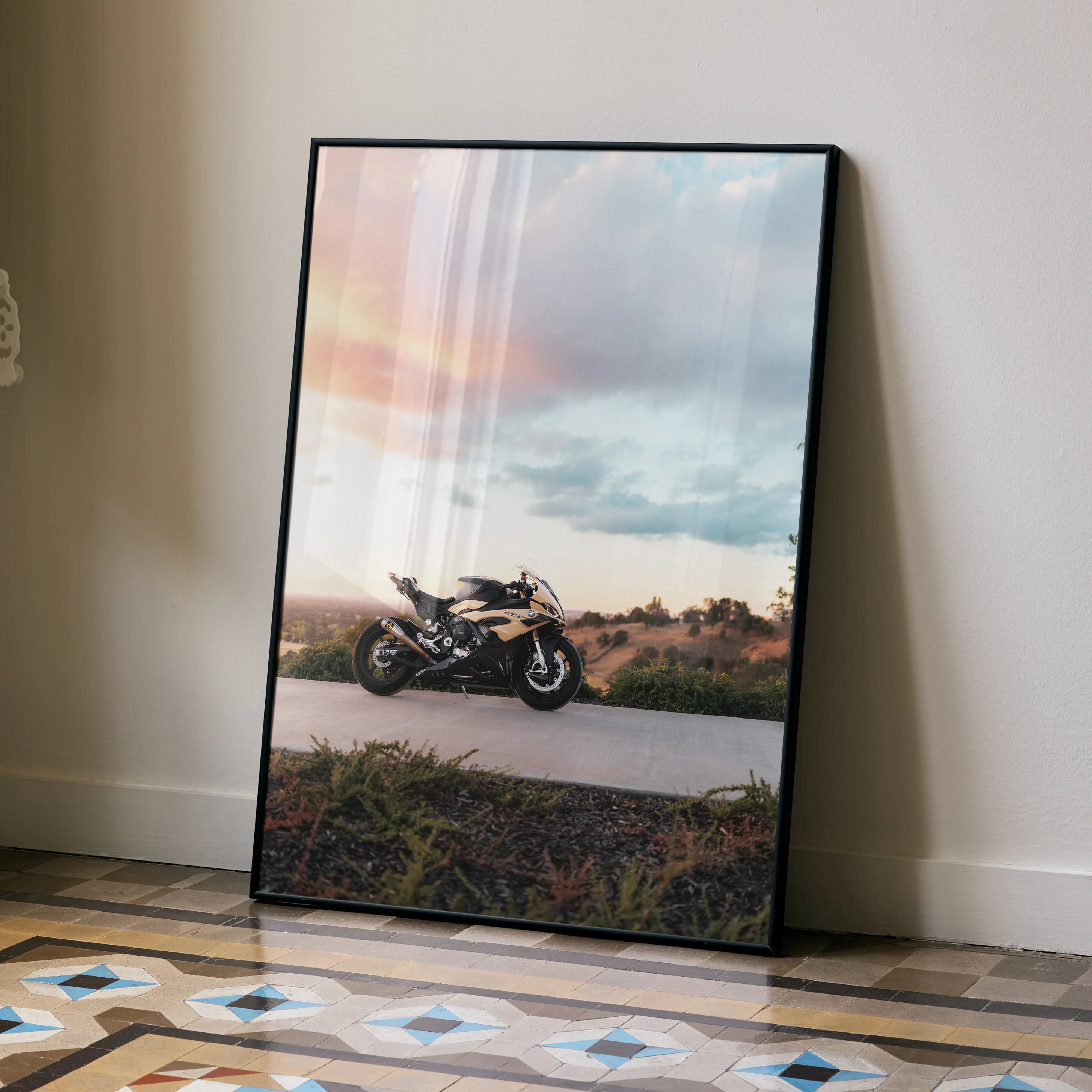 BMW S1000RR motorcycle poster with sunset sky, modern wall art in black frame.