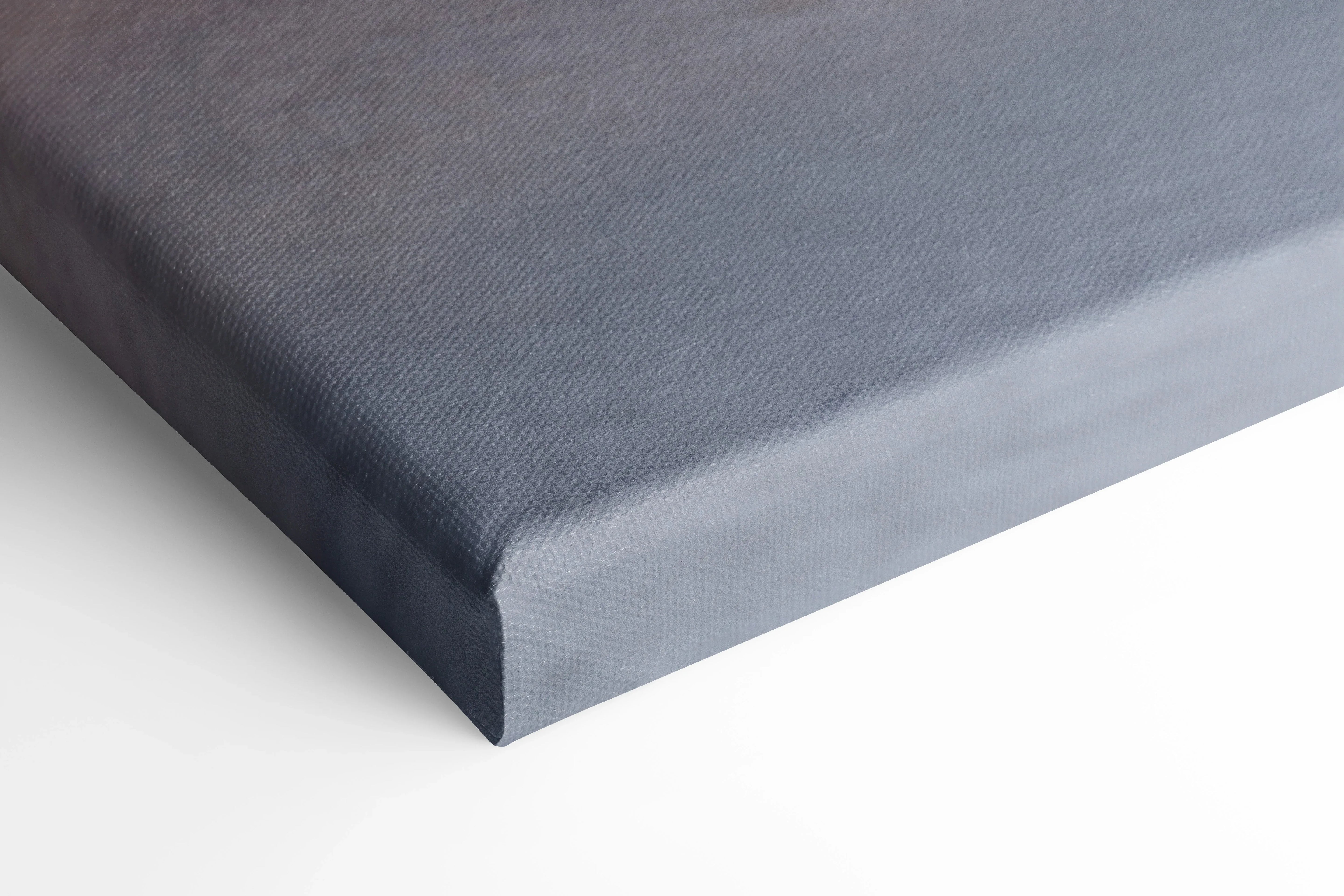 Close-up of dark gray stretched canvas corner, showcasing thick gallery-style wrap for wall art canvas print.