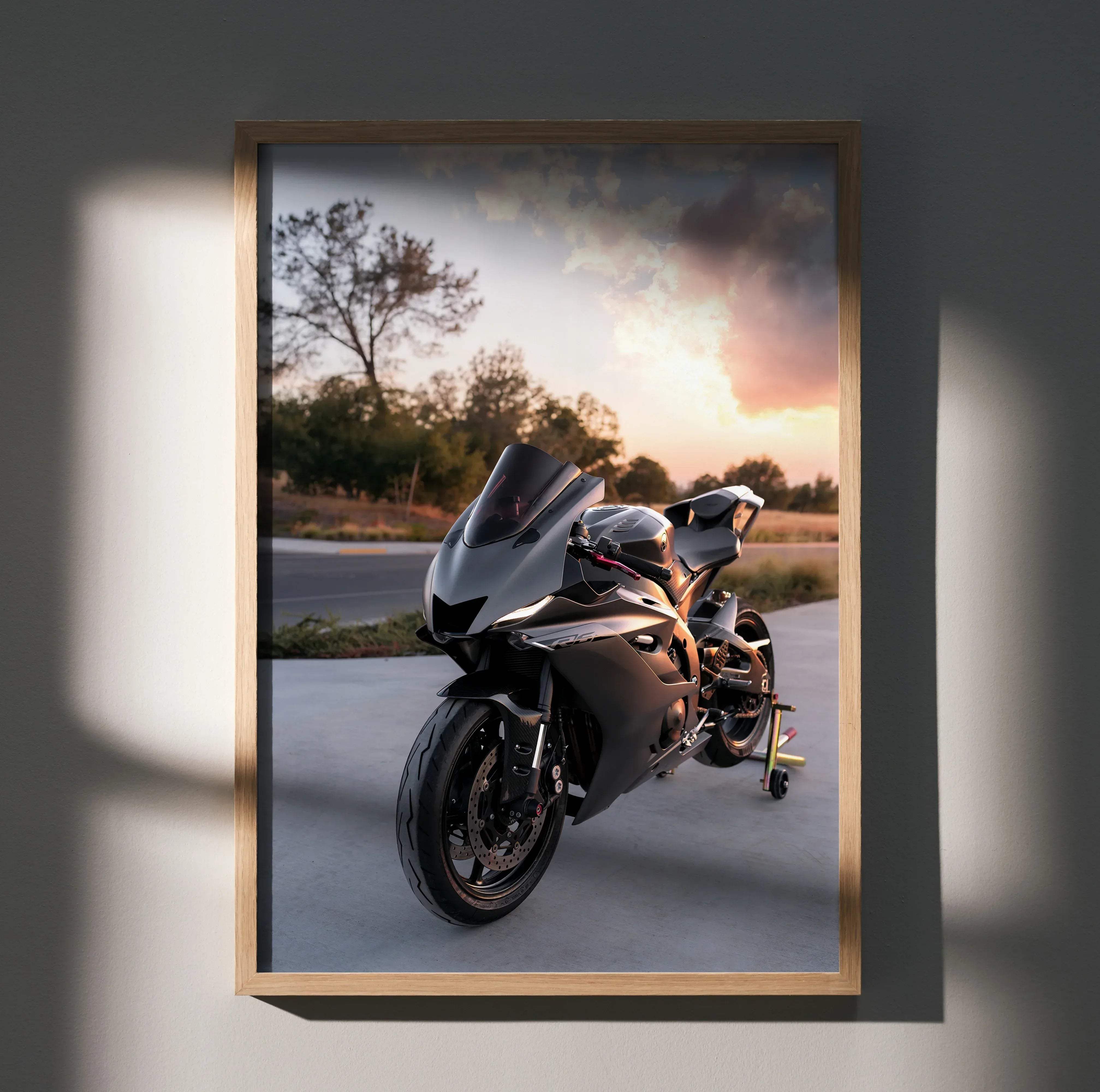 Yamaha R6 motorcycle poster featuring a black and silver sport bike in a light wood frame