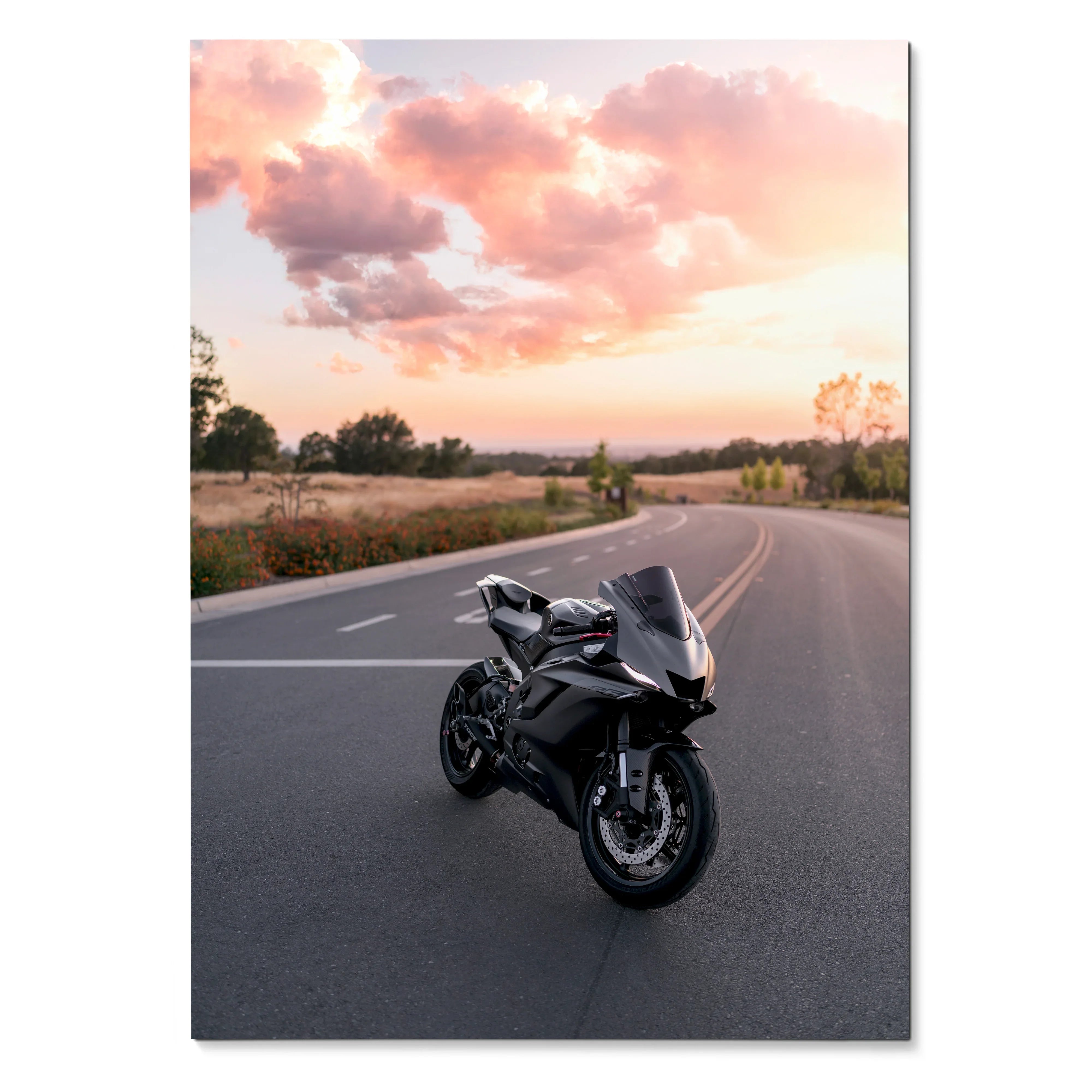 Black Yamaha R6 motorcycle on road at sunset, poster wall art with scenic sky and landscape.