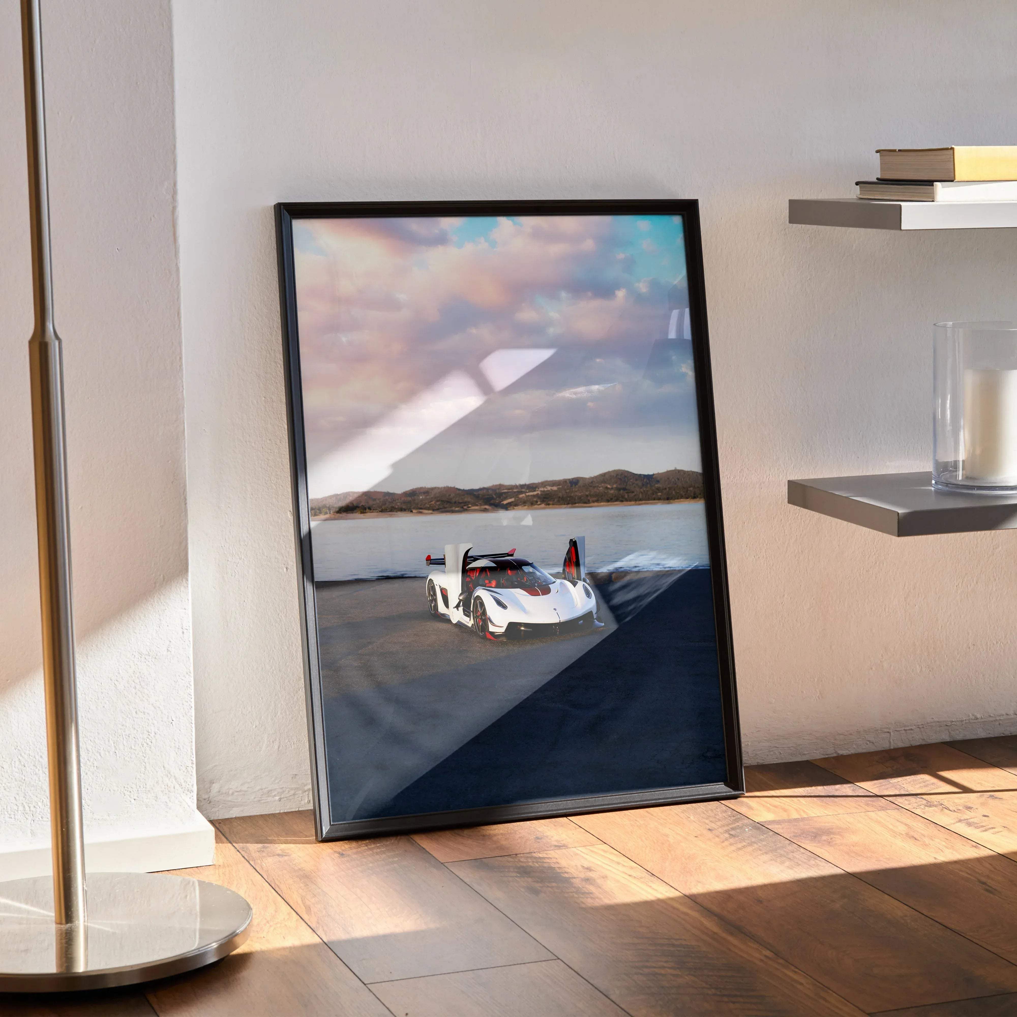 Black-framed poster of a white koenigsegg jesko sports car with red accents under a cloudy sky high resolution