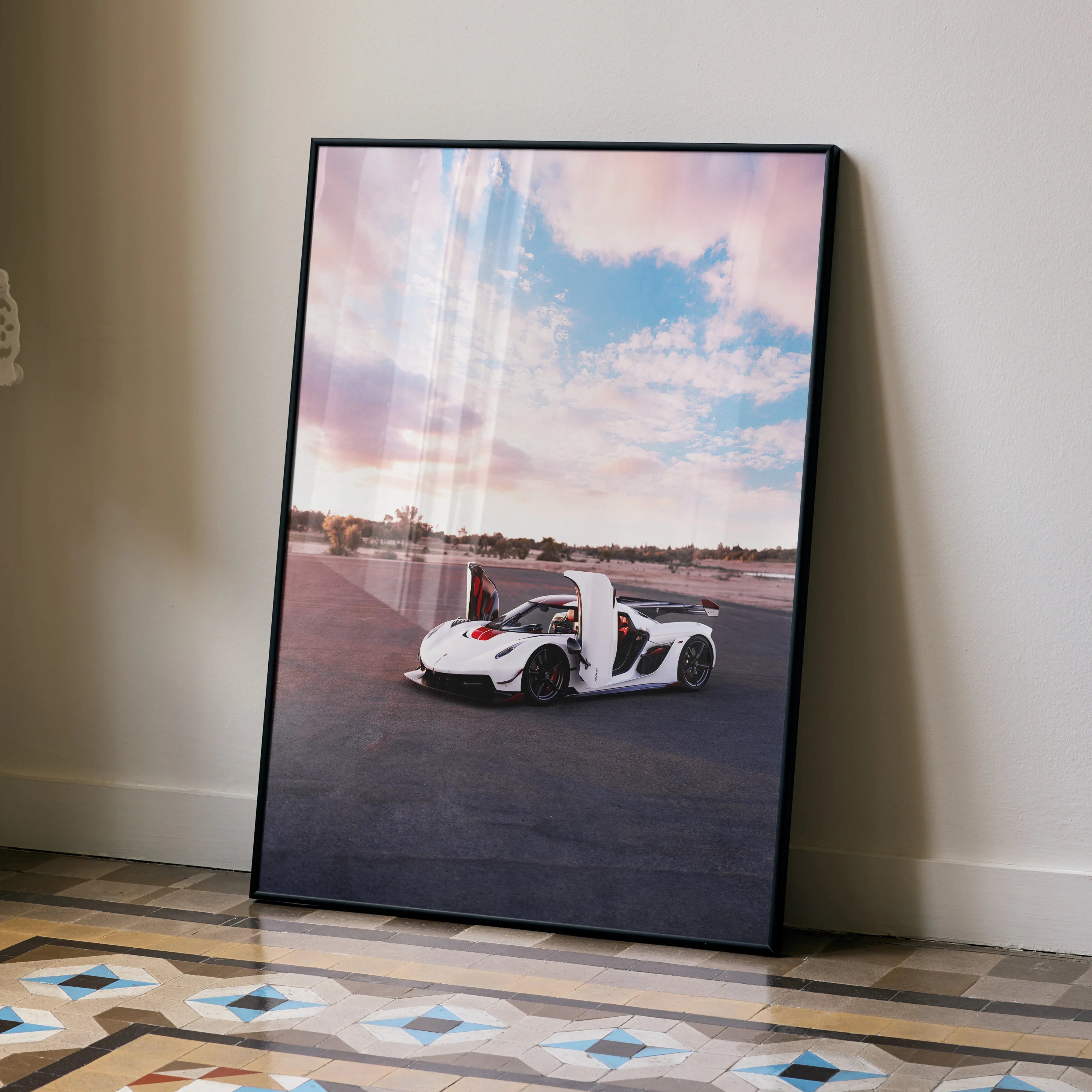 Koenigsegg Jesko car poster with white sports car on racetrack under pink and blue sky wall art.