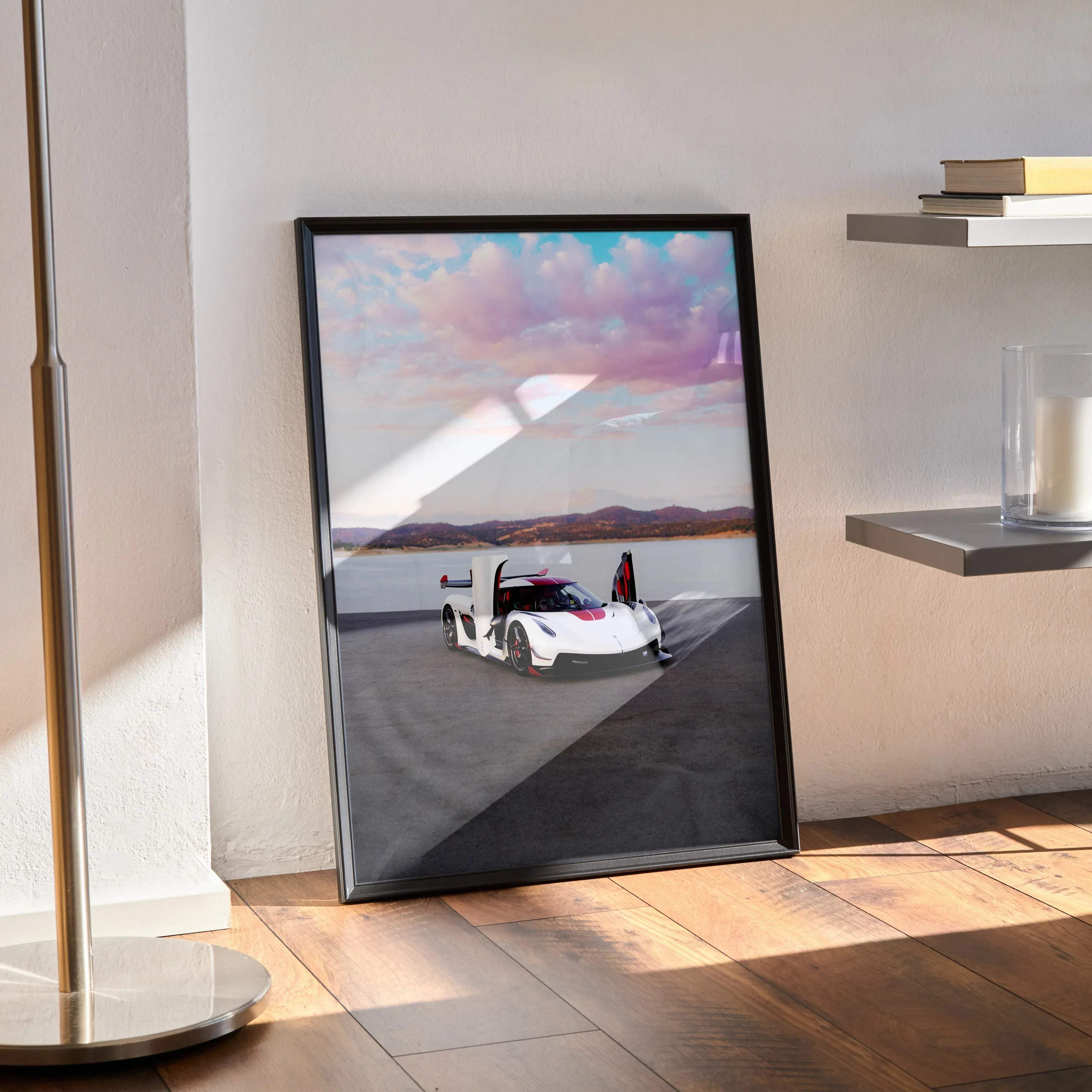 Black-framed poster of koenigsegg jesko white and red hypercar with open doors against pink clouds and mountains