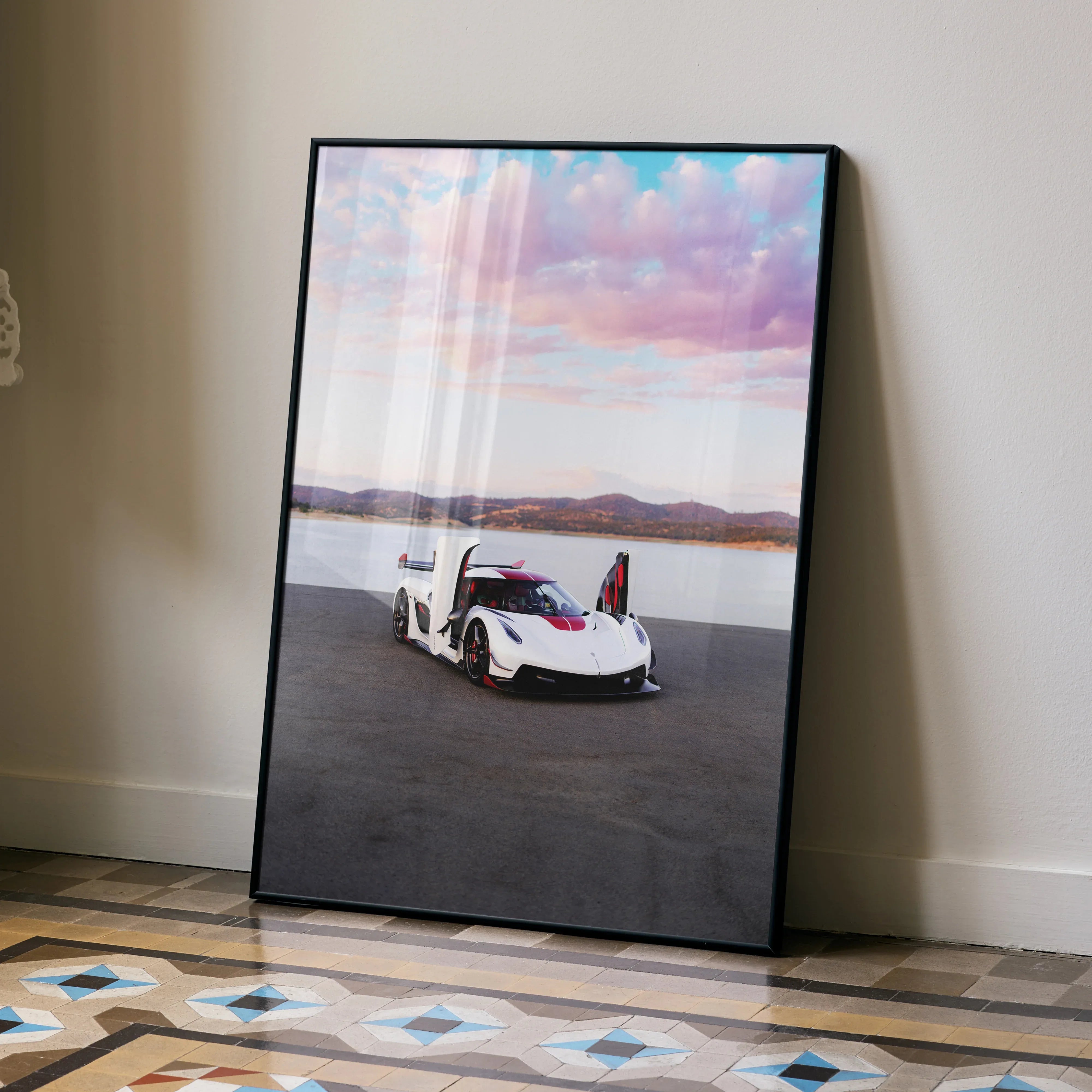 Koenigsegg Jesko poster wall art featuring white sports car with open dihedral doors against pink sky and desert background.
