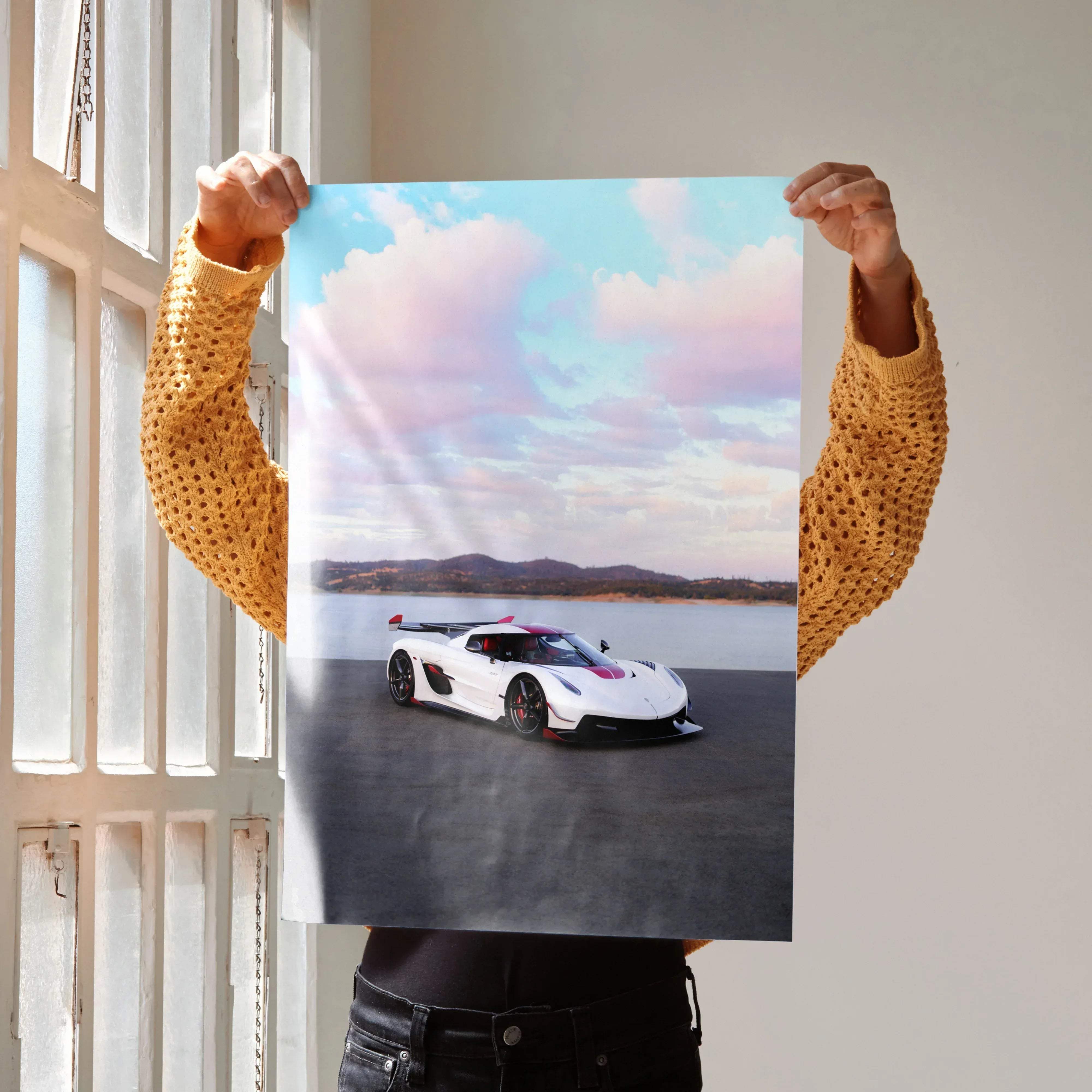 A white and red koenigsegg jesko hypercar poster featuring a sleek aerodynamic design with black accents