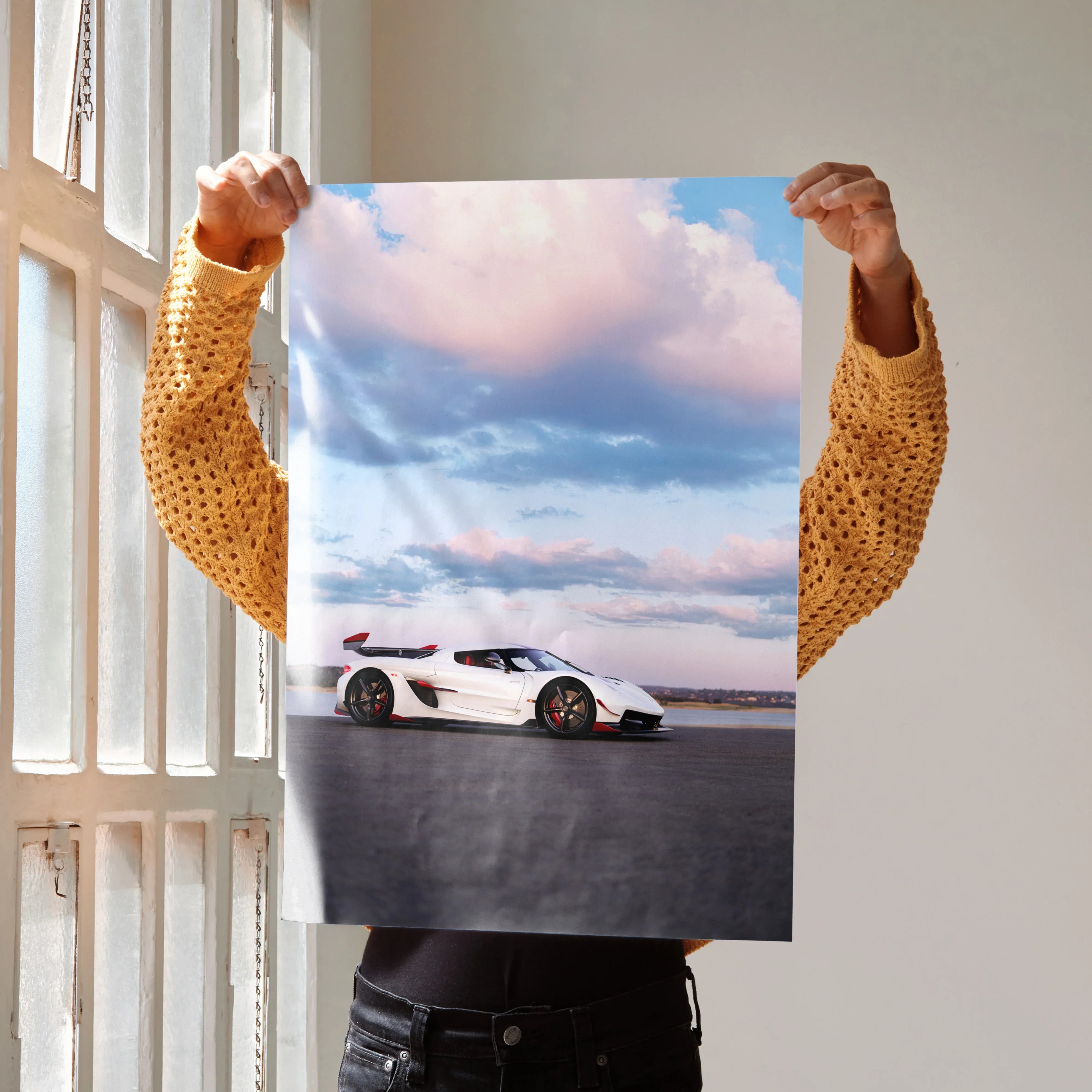 Koenigsegg Jesko car poster showing white sports car under blue sky with clouds, wall art.