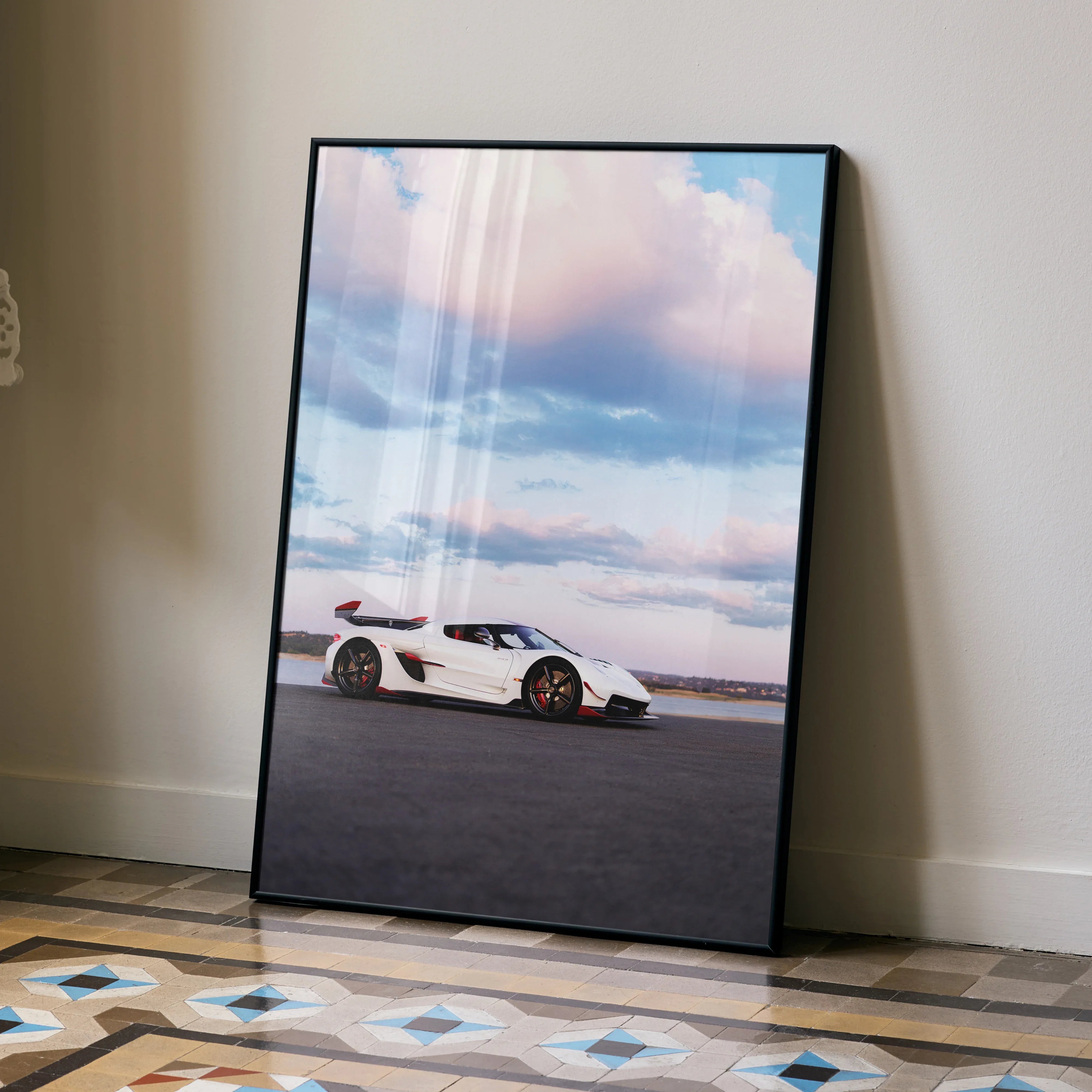 Koenigsegg Jesko car poster wall art with white supercar under blue sky clouds.