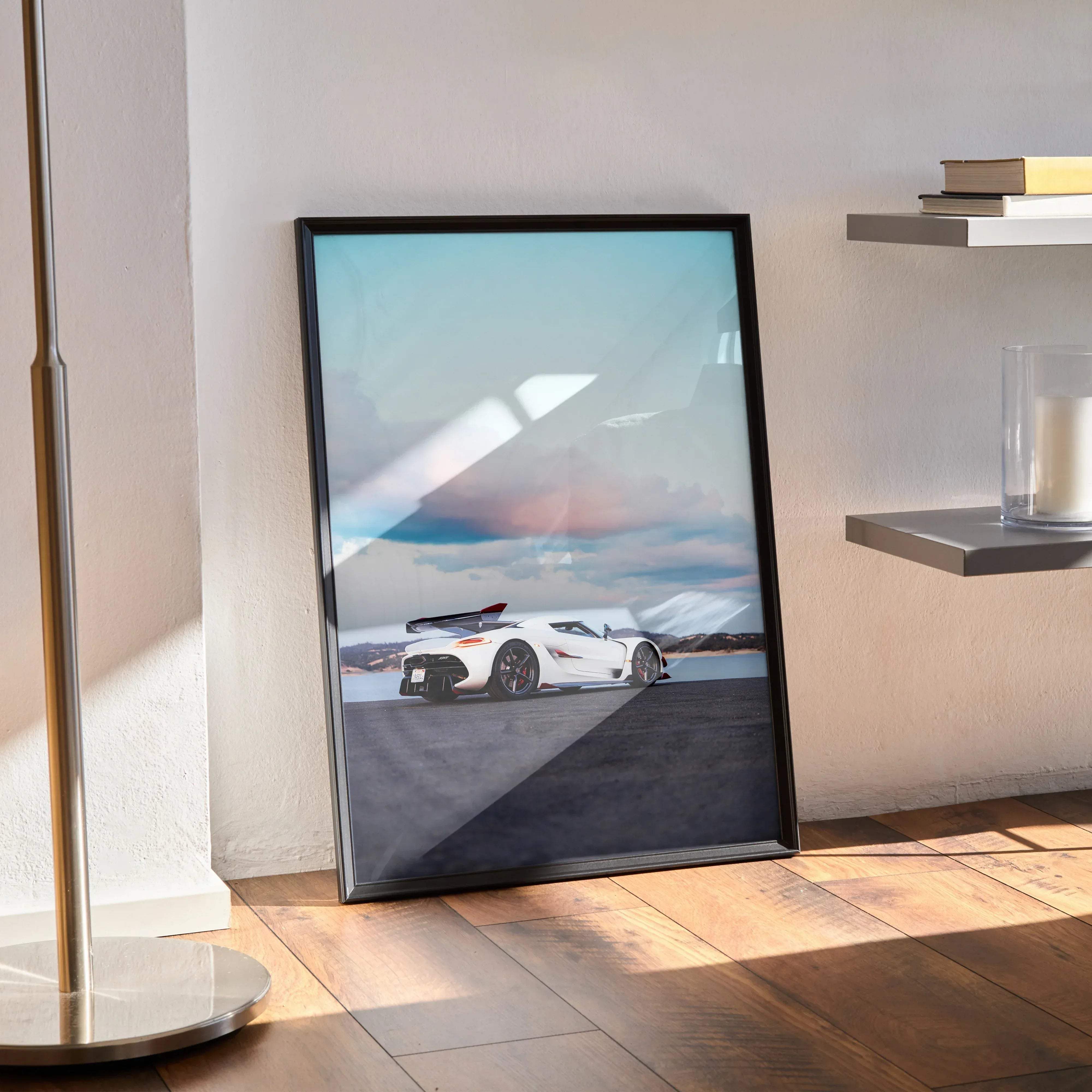 Black-framed koenigsegg jesko poster featuring a white sports car against a sky with soft pastel clouds