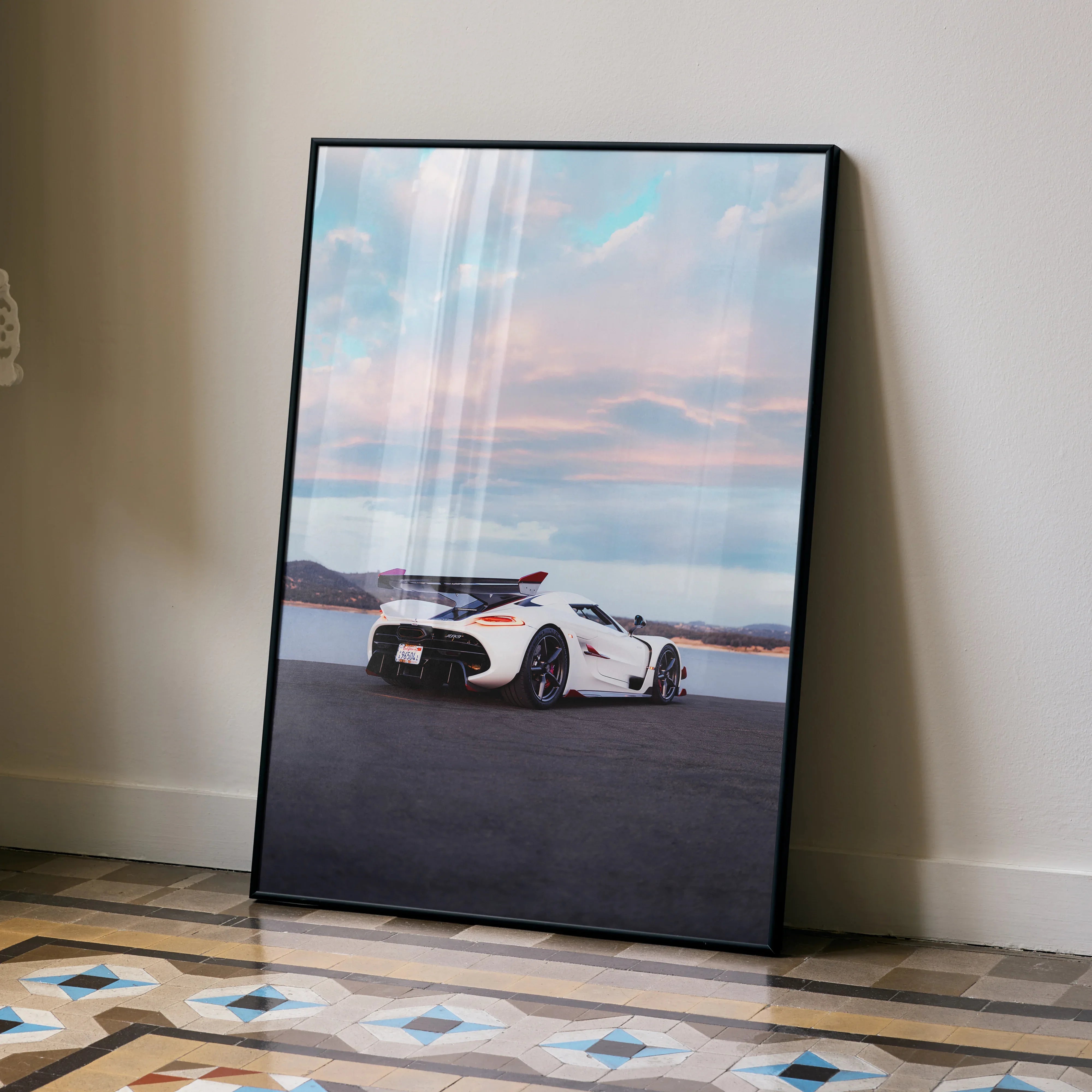 Koenigsegg Jesko car poster with white sports car on open road at sunset, sleek wall art.