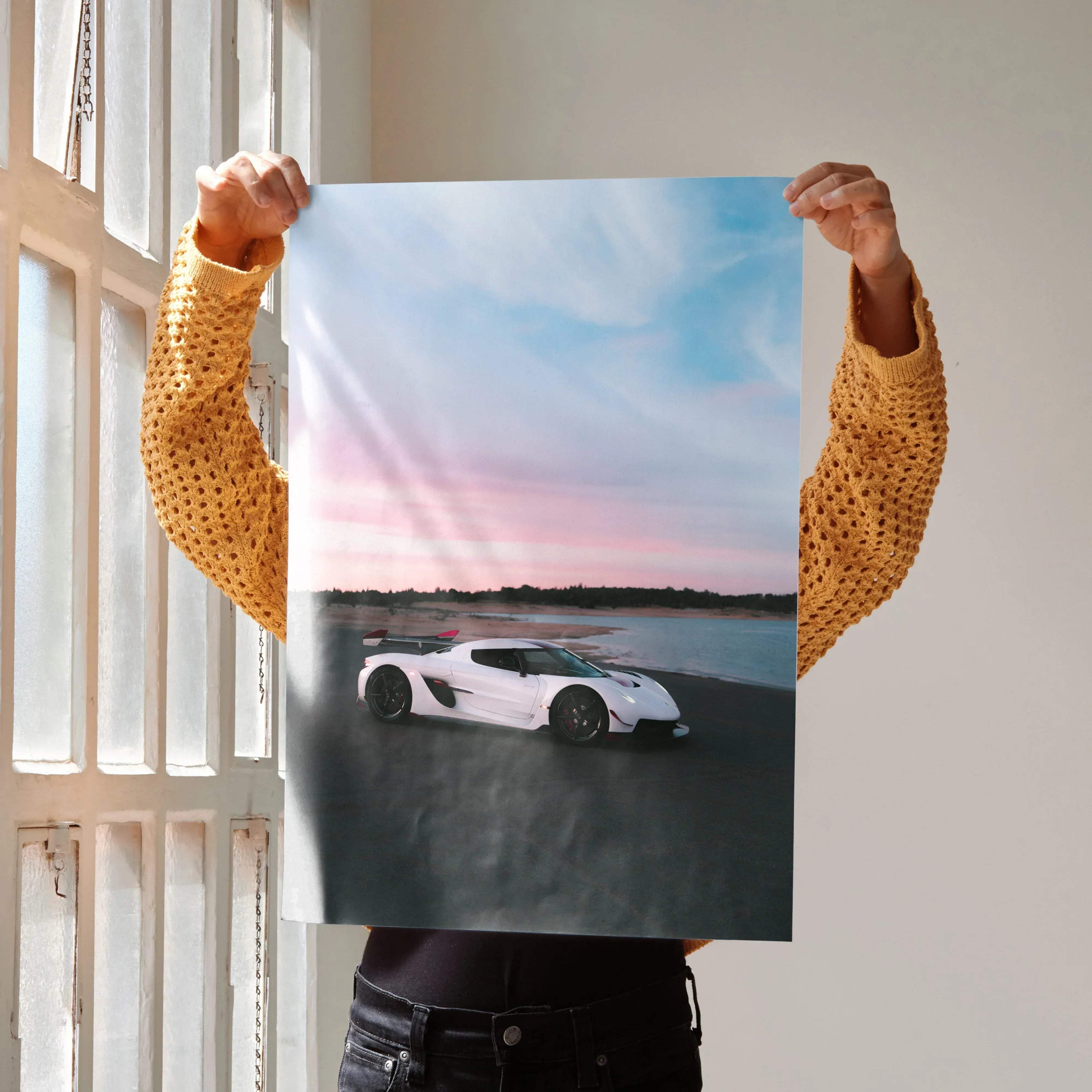 White koenigsegg jesko hypercar poster featuring sleek aerodynamic design black wheels against pink blue twilight sky