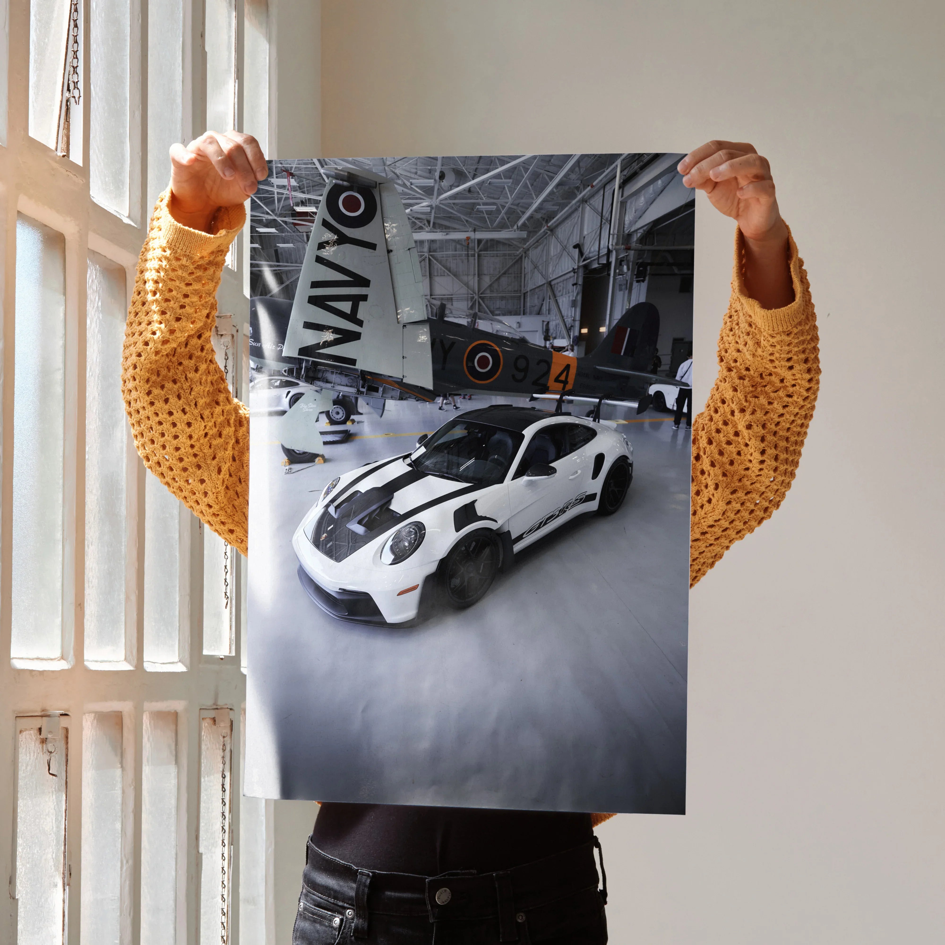 Porsche 911 GT3 RS white sports car poster with vintage airplane hangar wall art.