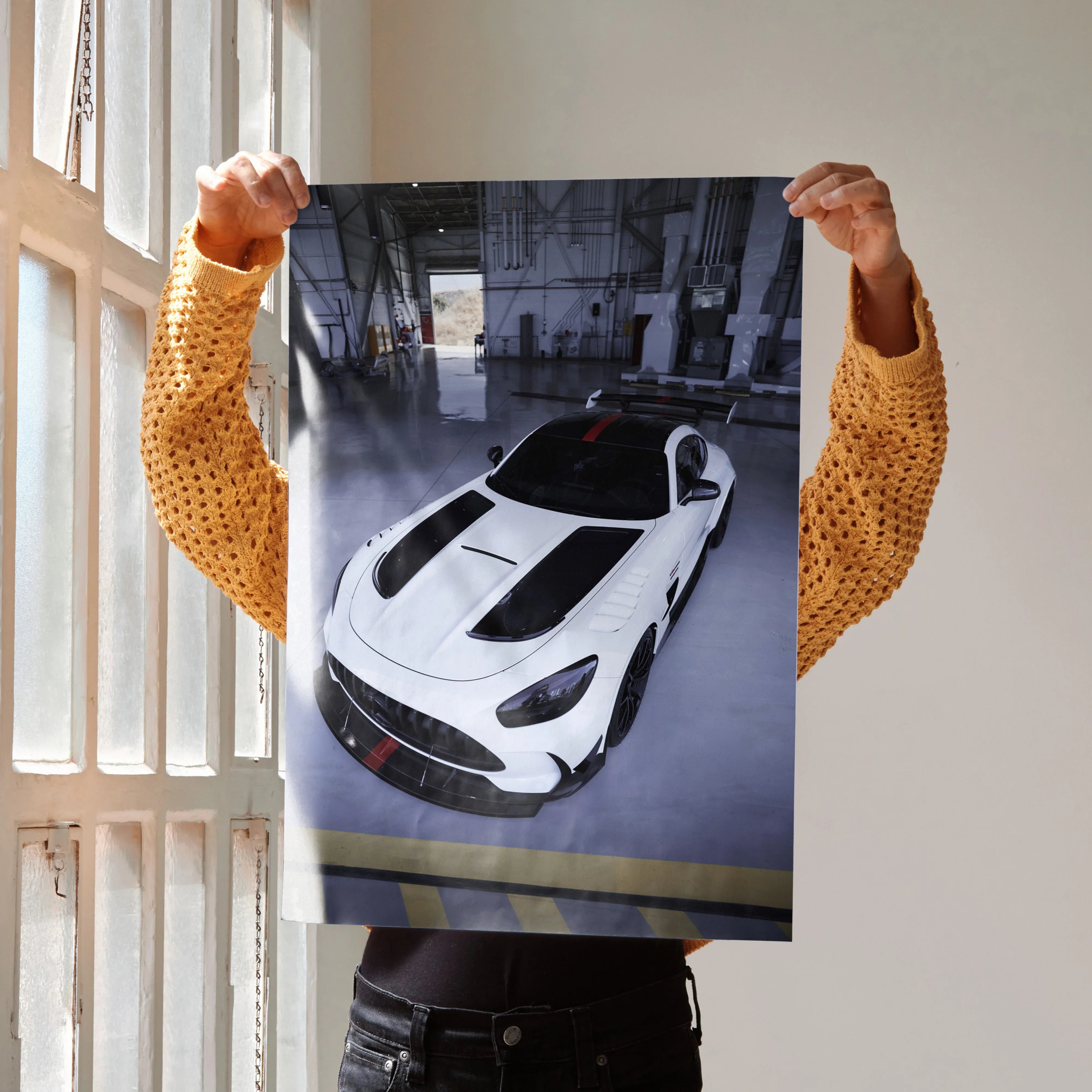 Mercedes AMG GT Black Series poster showing white sports car with black accents in garage wall art.