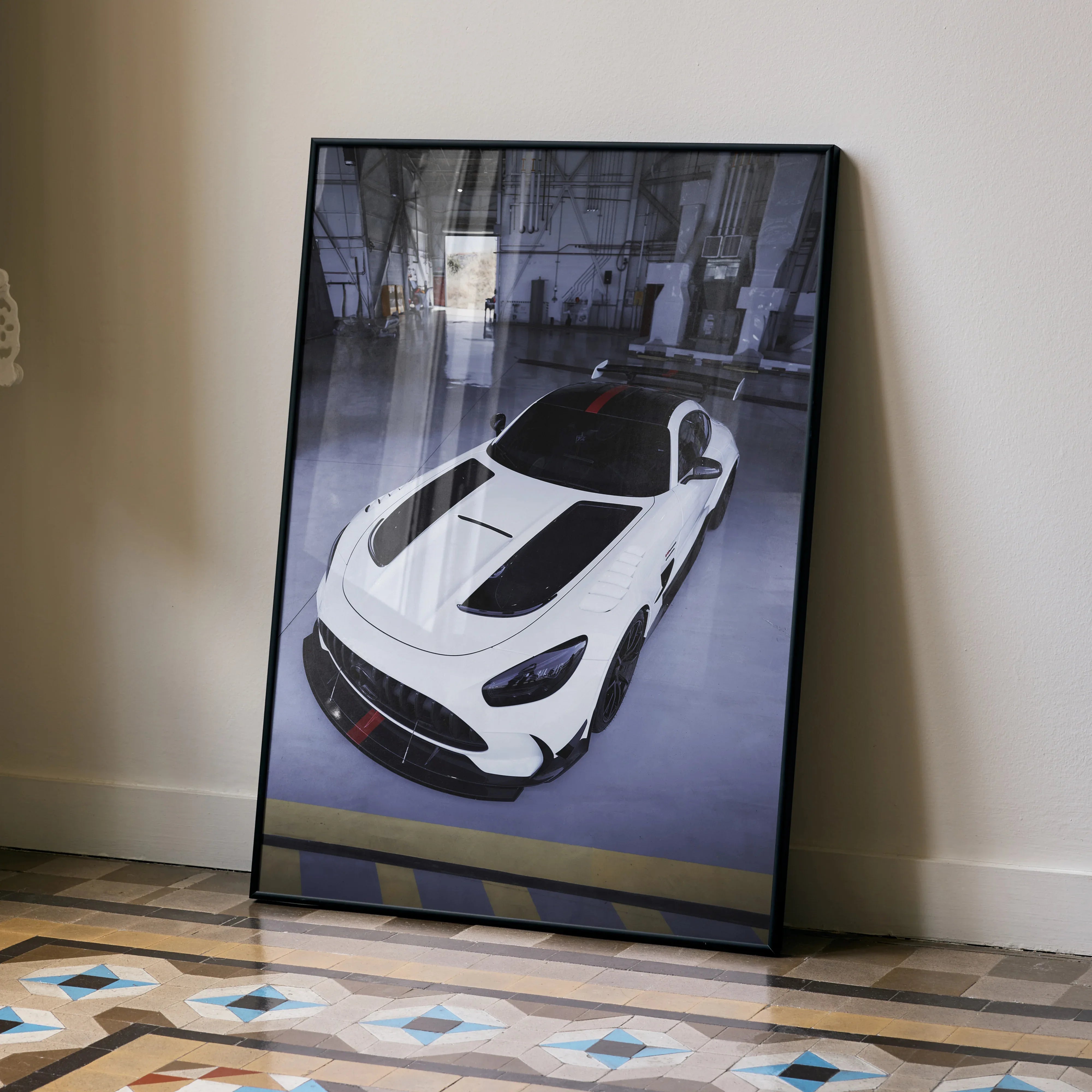 Mercedes AMG GT Black Series white sports car poster leaning against beige wall wall art.