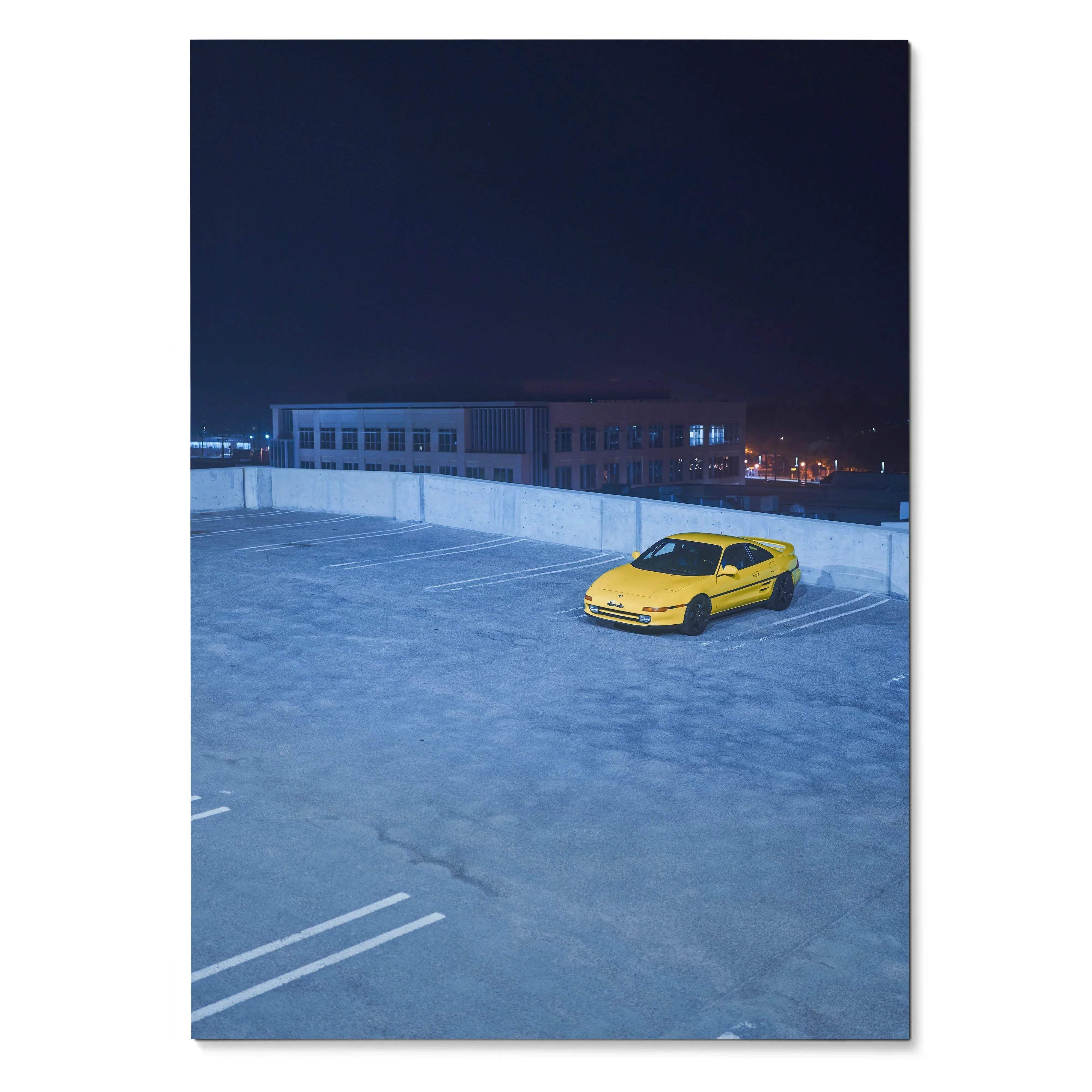 Yellow Toyota MR2 parked alone on rooftop at night poster wall art.