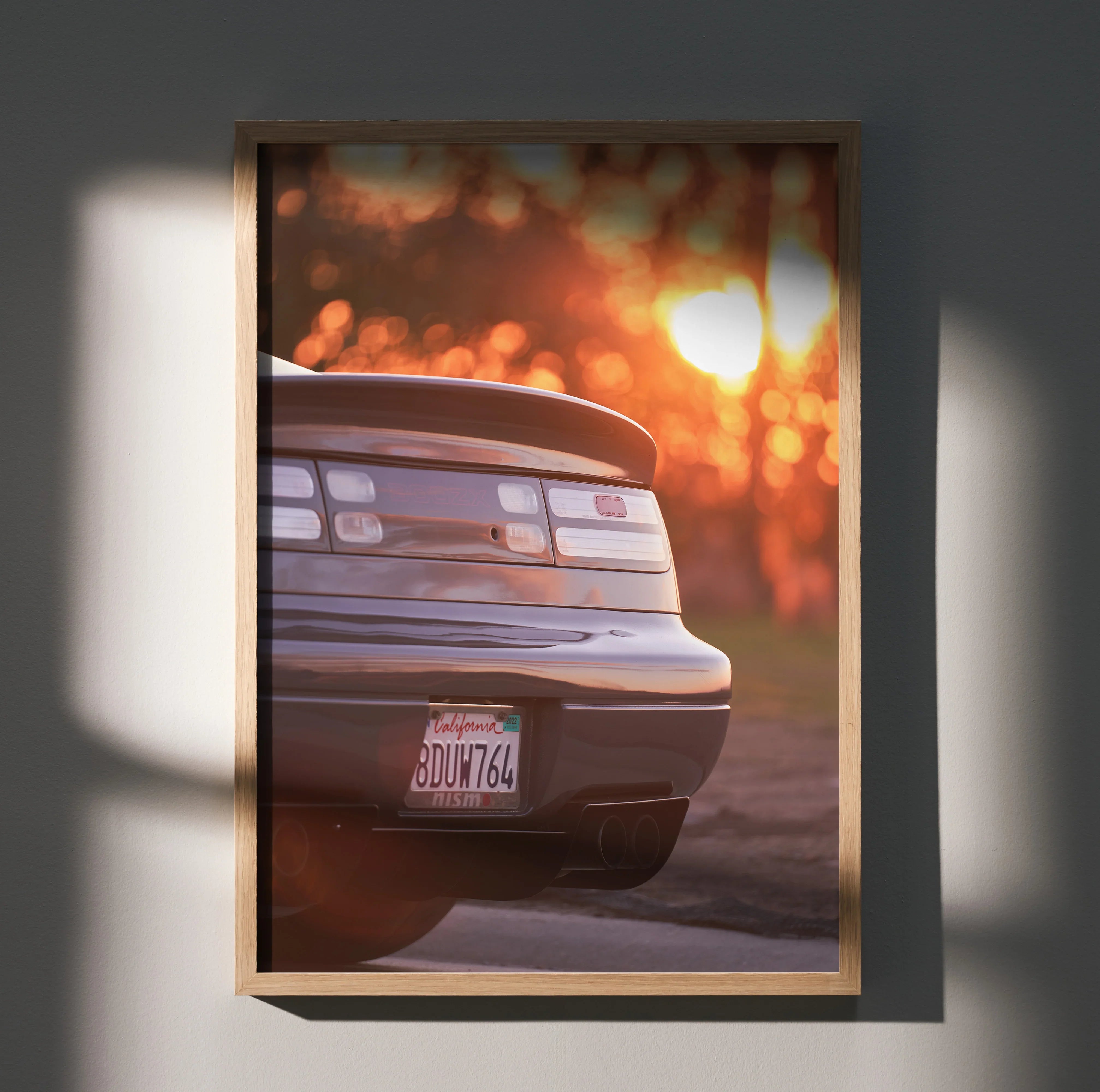 Nissan 300ZX rear view poster with sunset glow, sleek car details, iconic wall art.