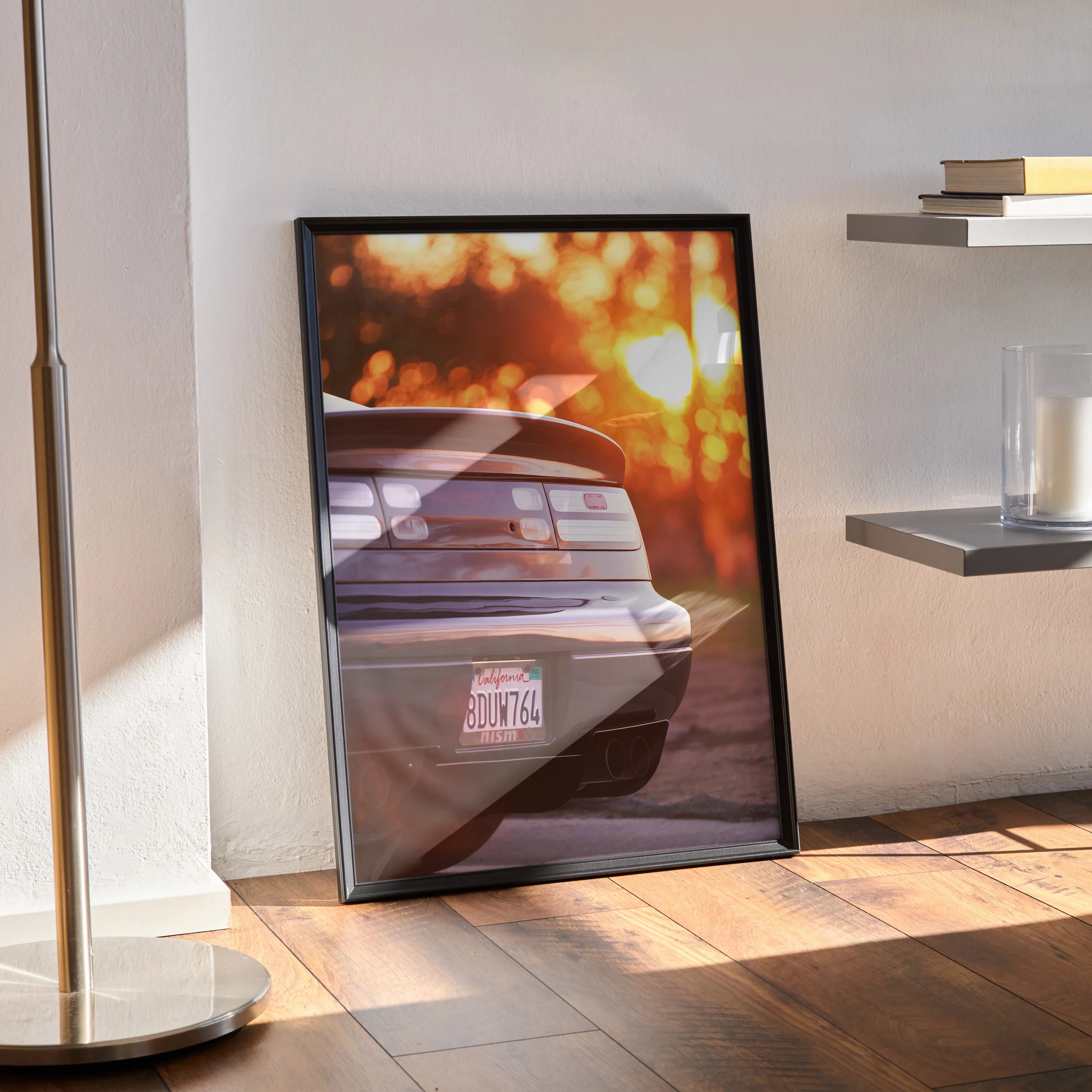 Nissan 300ZX poster wall art featuring rear view with sunset bokeh in black frame.
