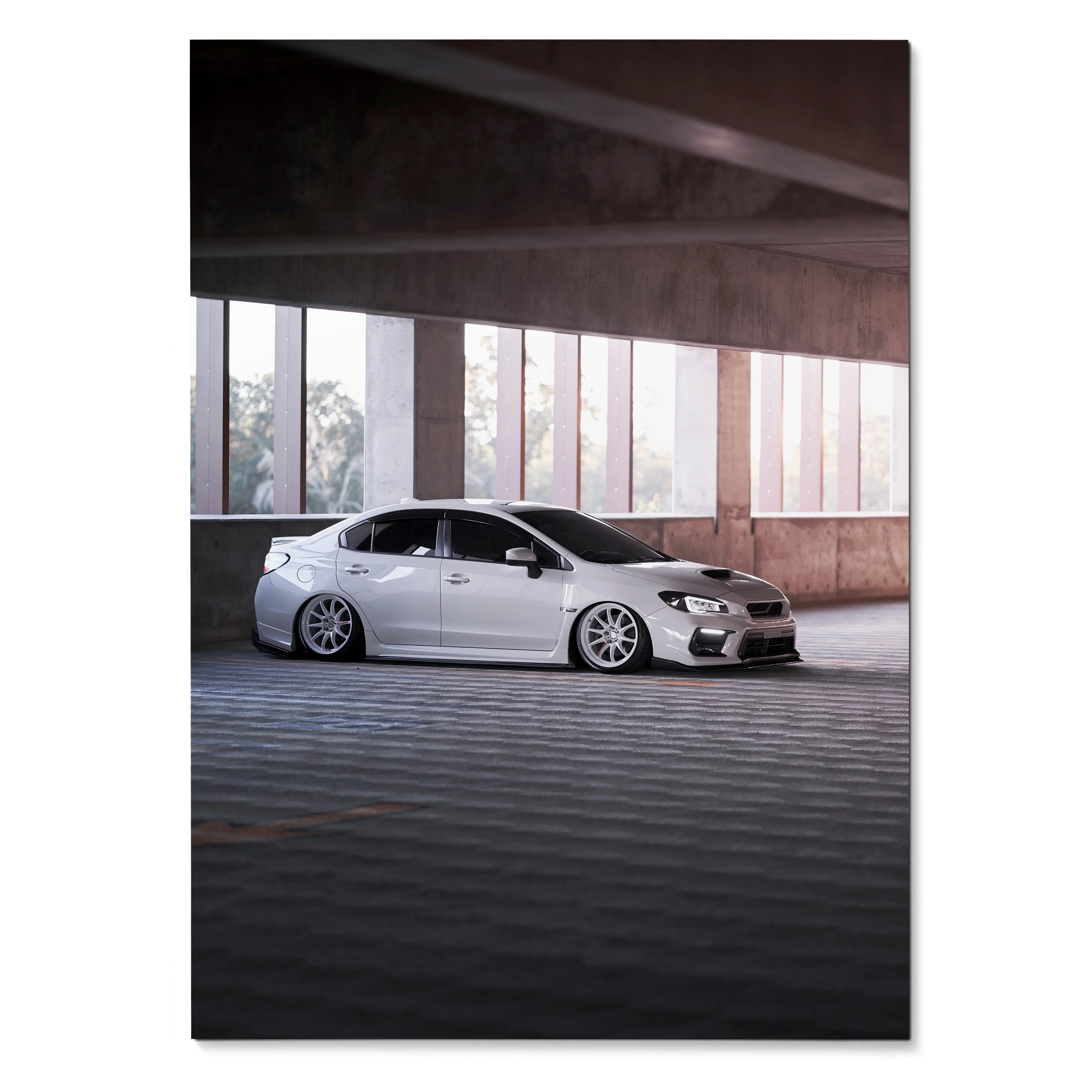 Subaru WRX white sports car parked under concrete ceiling in modern garage poster wall art.