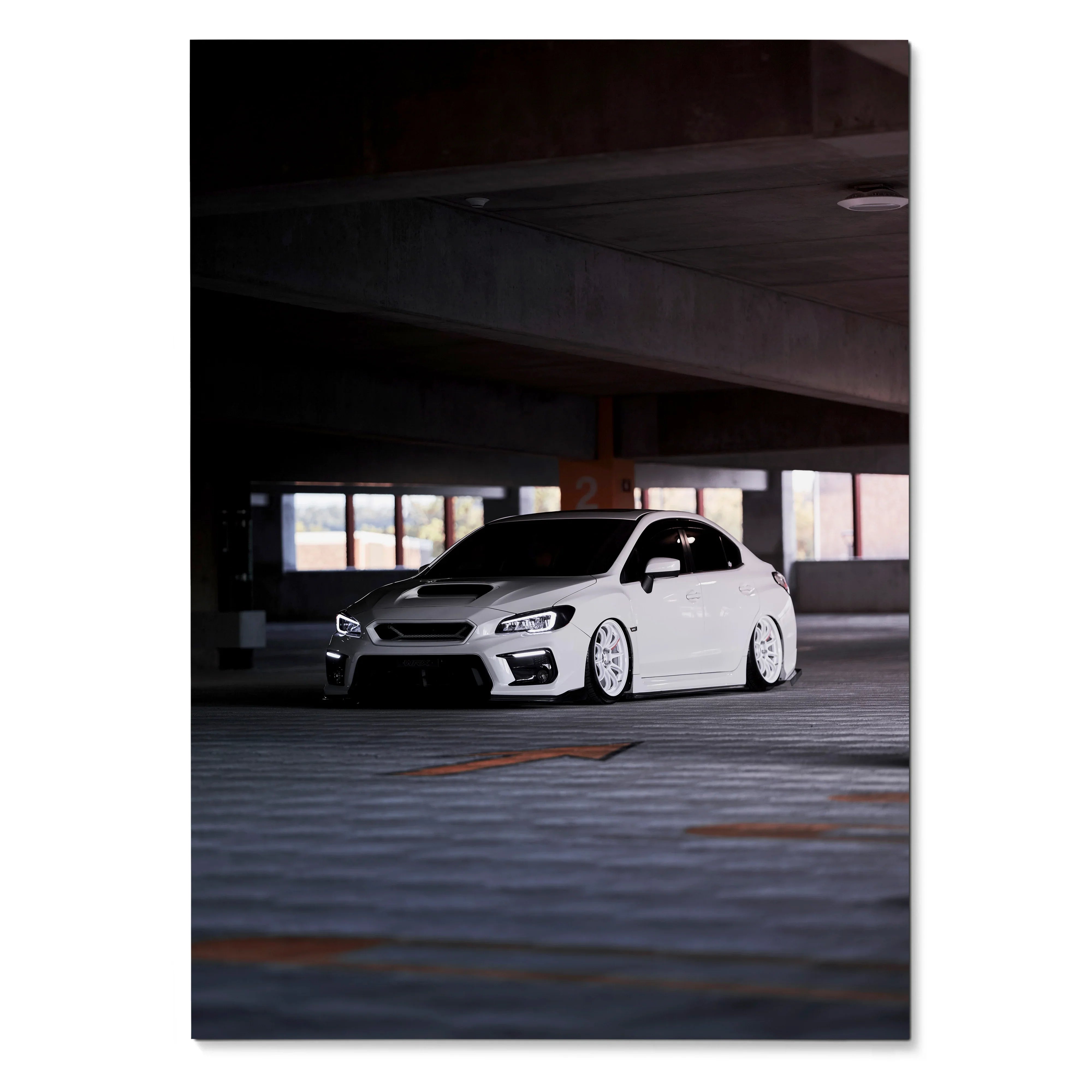 Subaru WRX white car poster with lowered stance in industrial parking garage wall art.