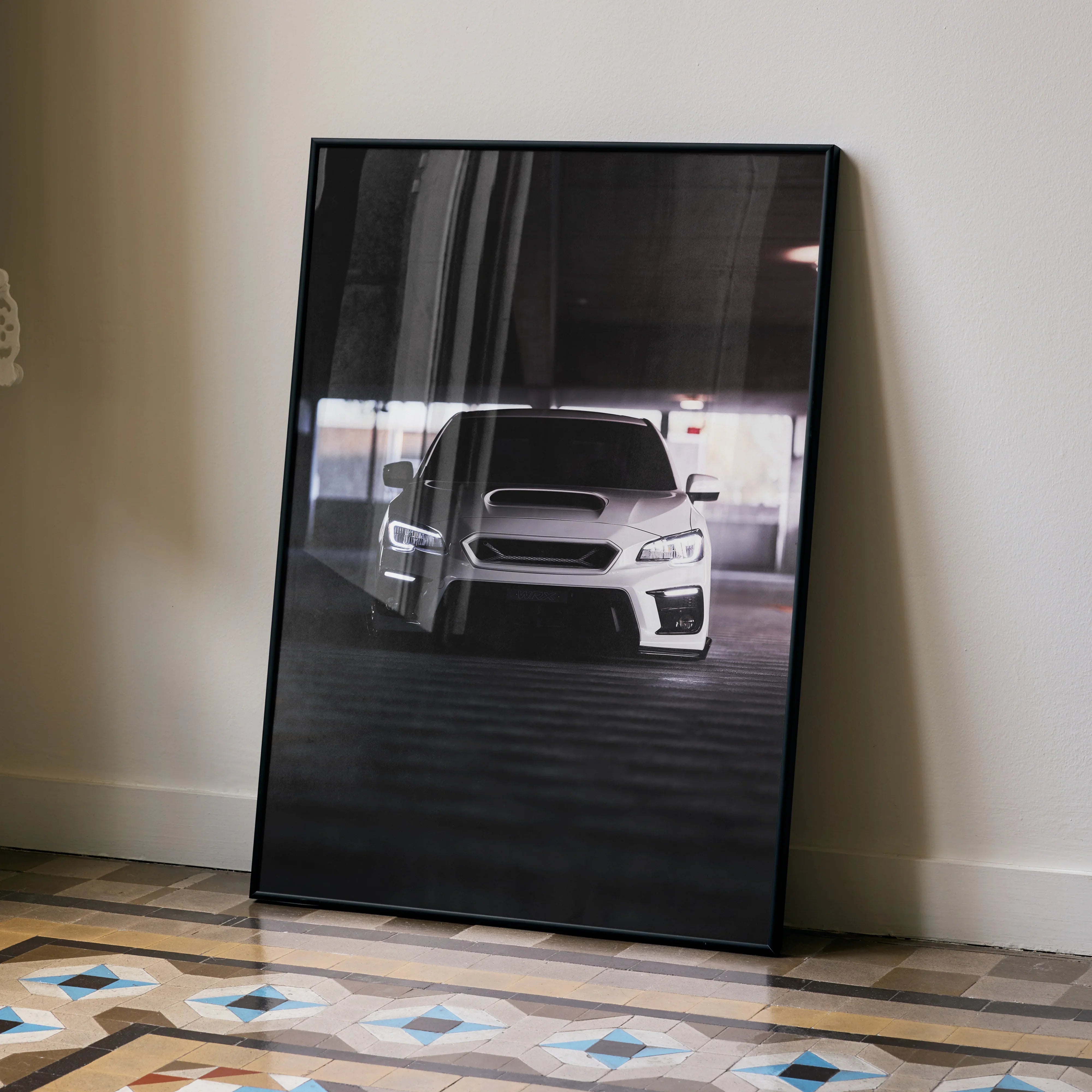 Subaru WRX poster wall art featuring a white car in a dark garage with high contrast lighting.