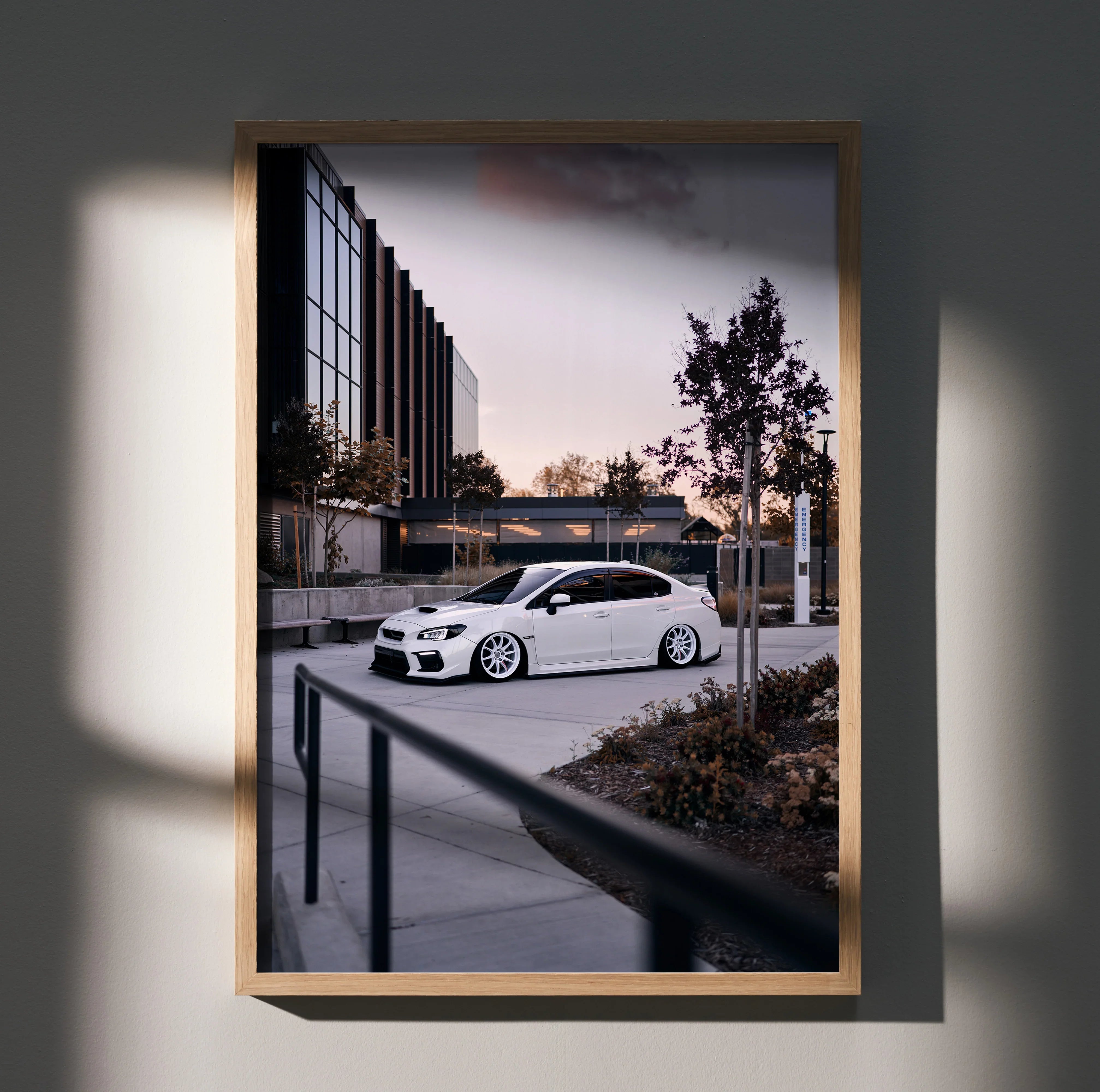 Subaru WRX white car parked at sunset modern urban setting poster wall art in wooden frame.