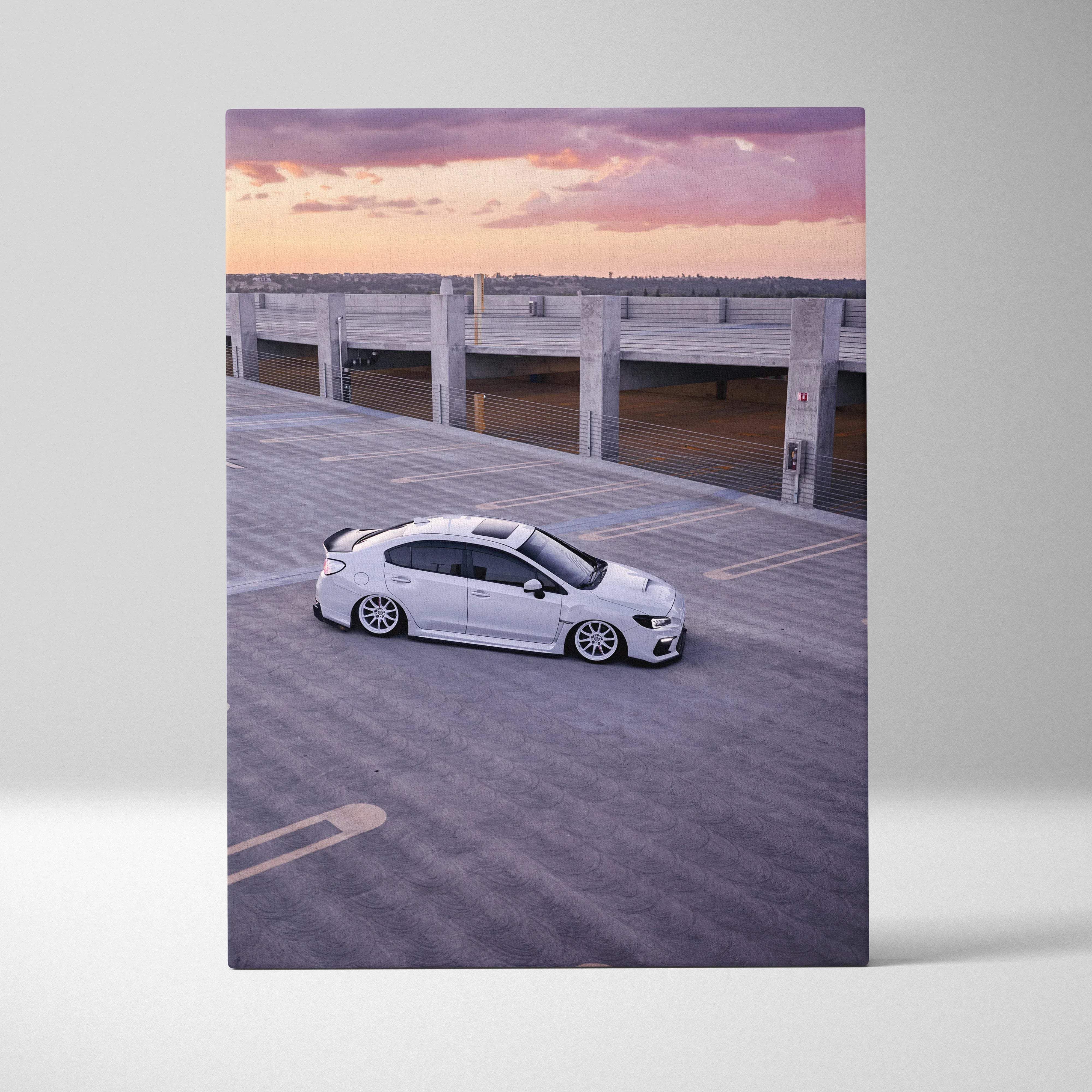 White subaru wrx sedan canvas wall art with sleek sporty design and custom alloy wheels against purple sunset sky