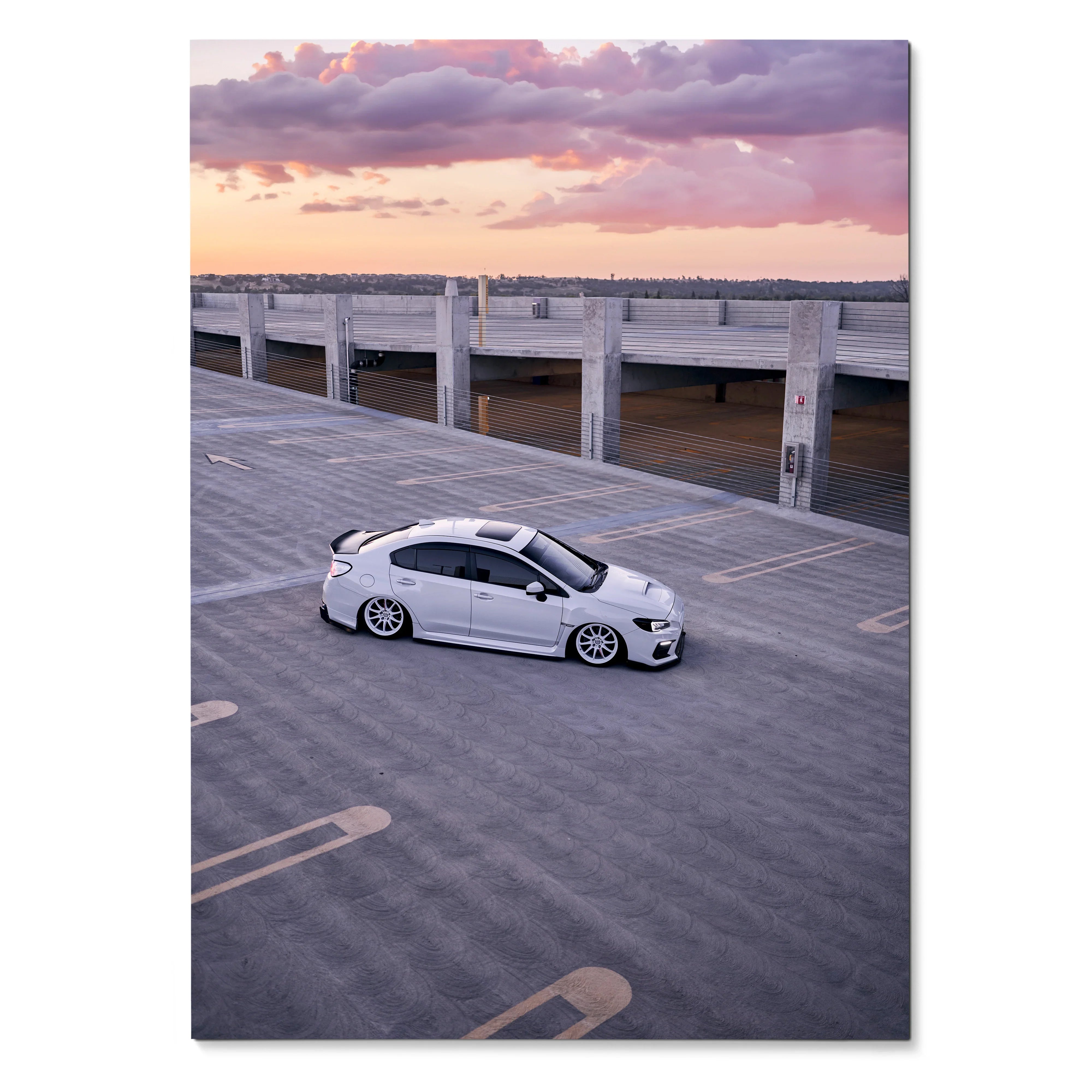 Subaru WRX parked on rooftop at sunset with vibrant sky poster wall art.