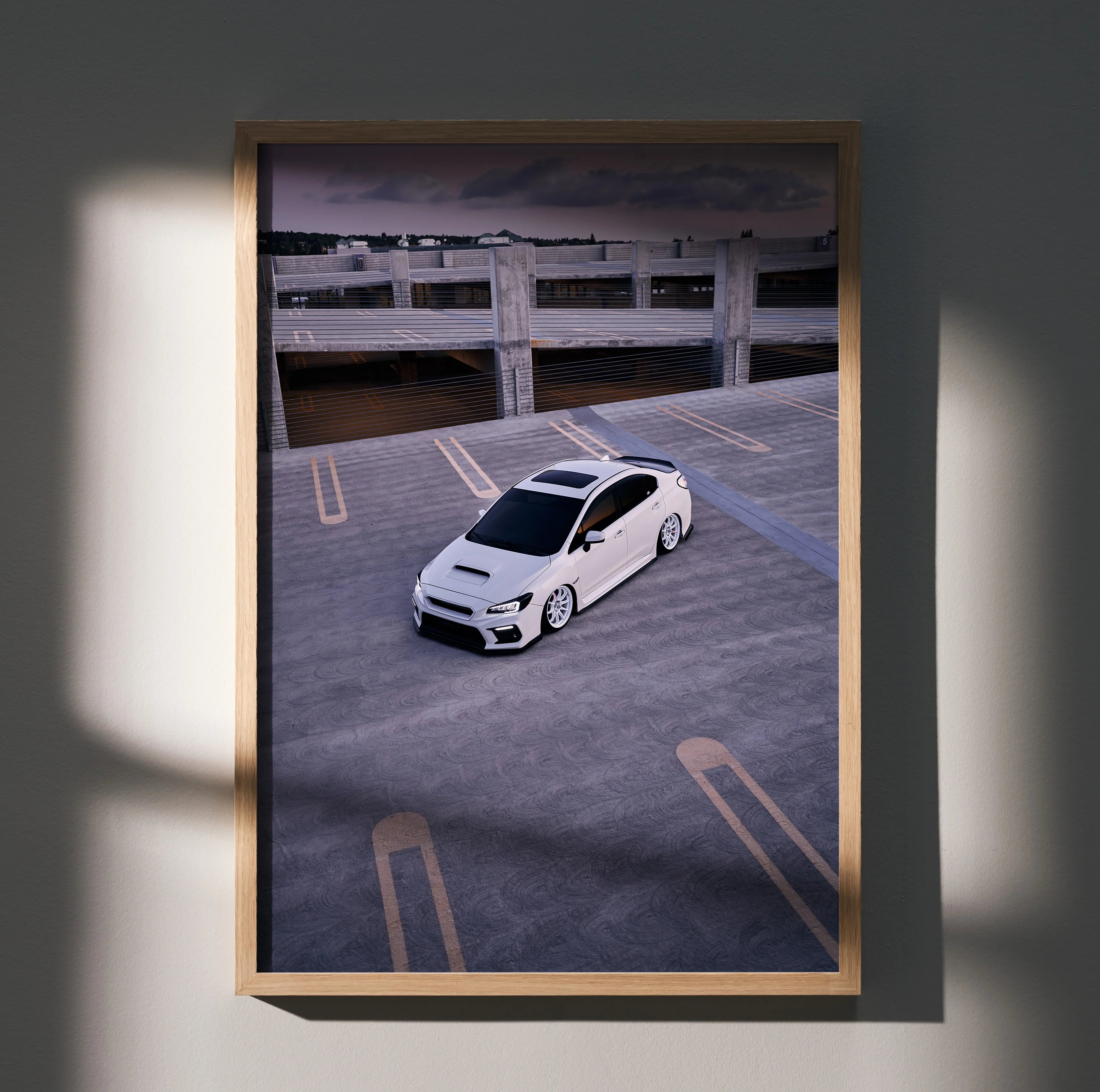 Subaru WRX white car in empty parking lot poster wall art with moody lighting and shadow.