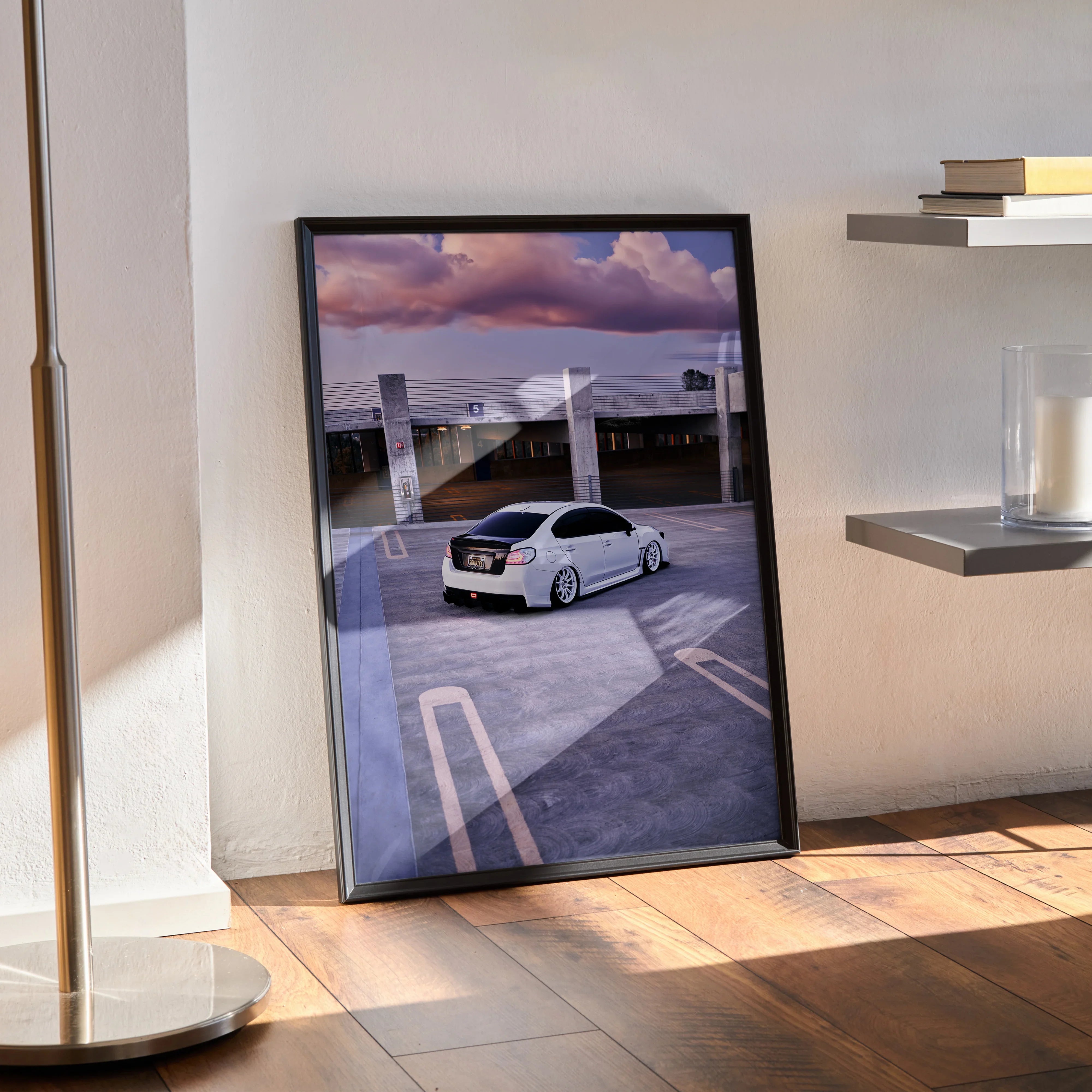 Subaru WRX poster wall art featuring a white car on rooftop with dramatic purple sky in black frame.