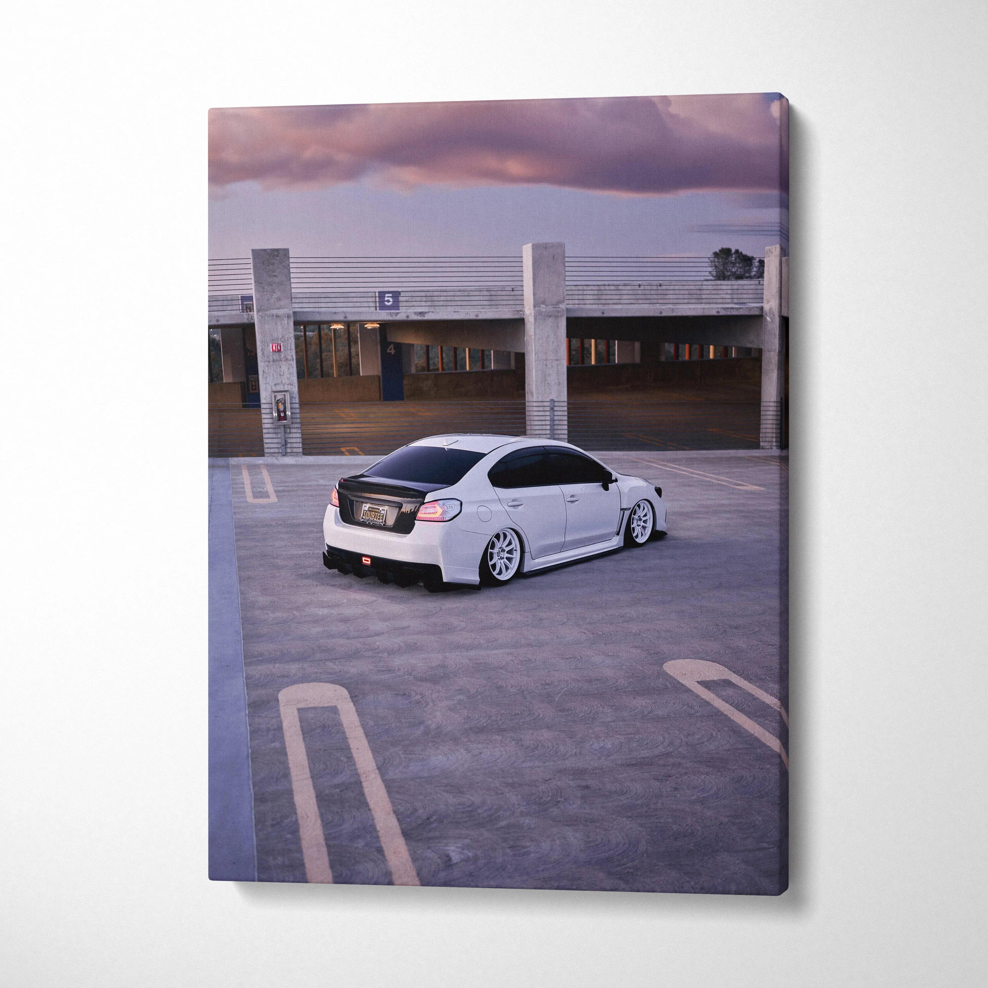 White Subaru WRX parked in rooftop lot at sunset on vertical canvas wall art.
