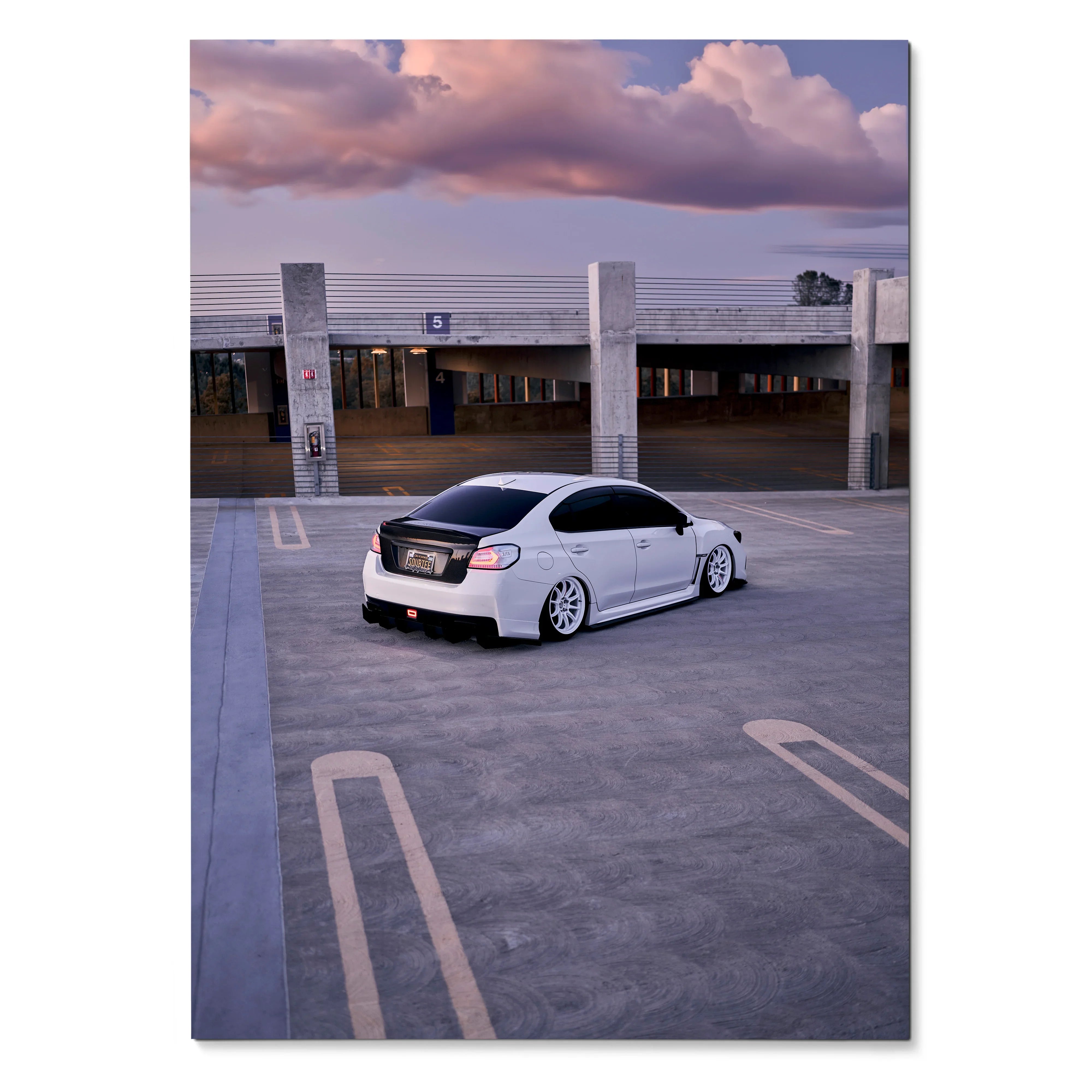 Subaru WRX poster with white car in empty rooftop parking at sunset wall art.