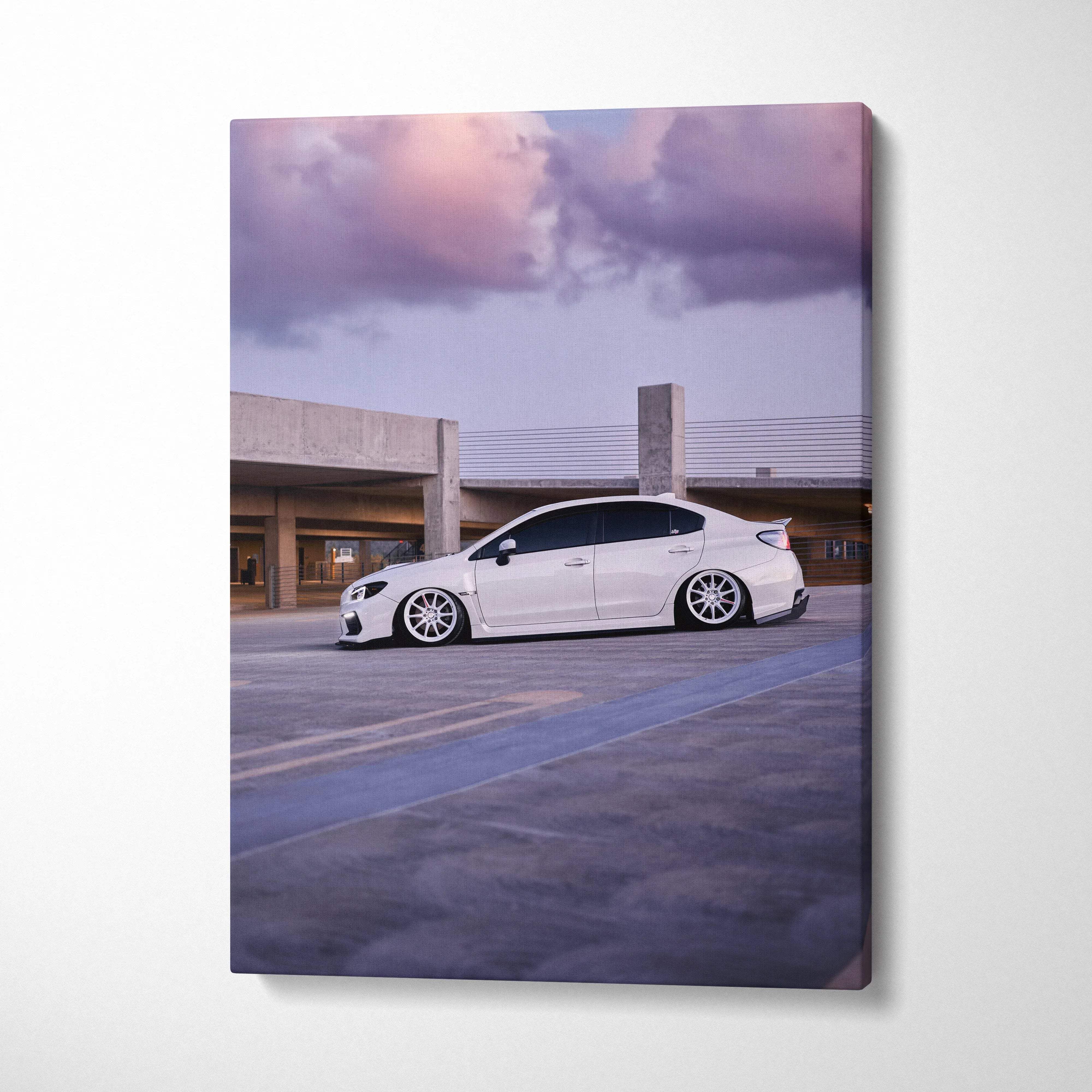 Canvas wall art museum quality vertical featuring a white Subaru WRX sedan with custom wheels and lowered suspension on purple sunset