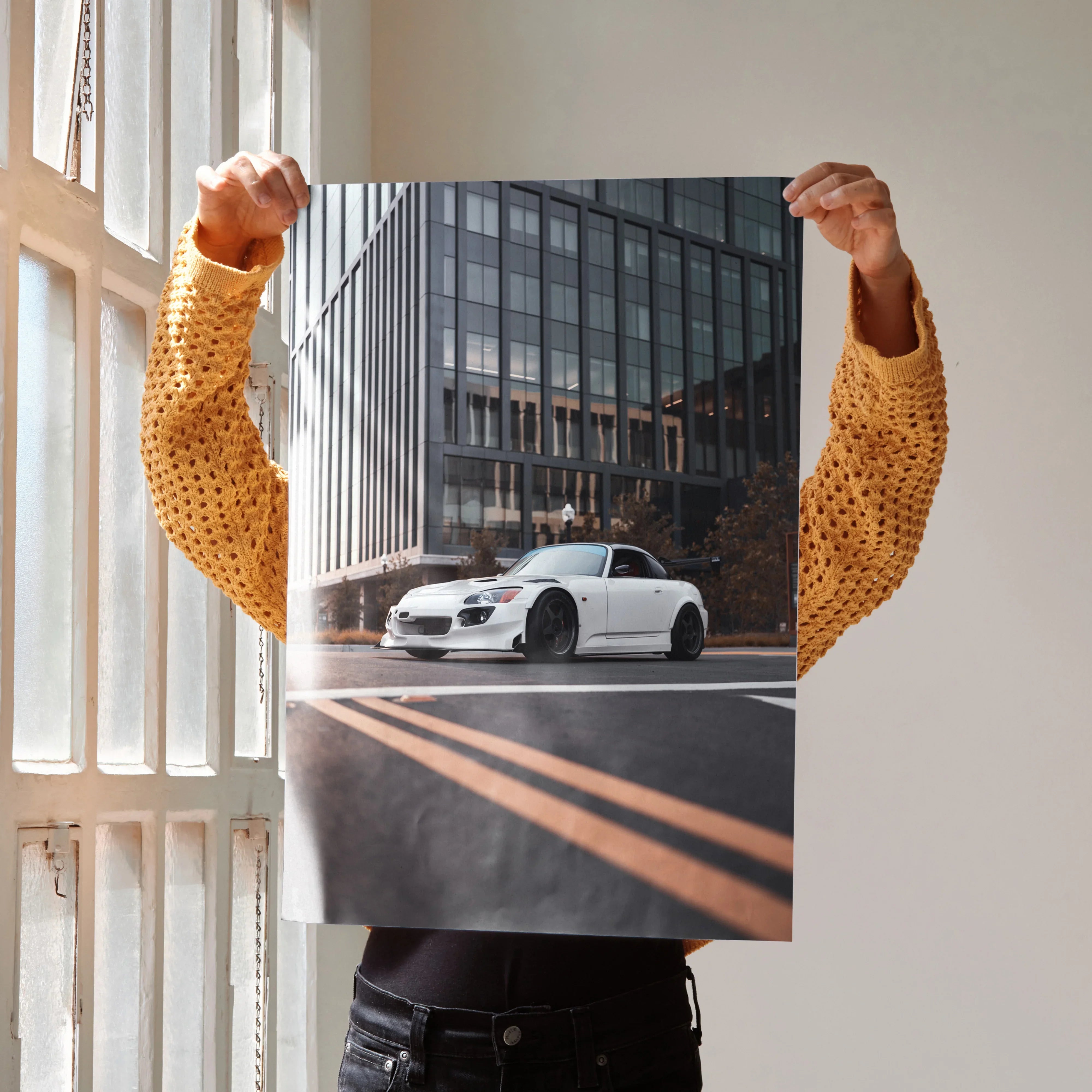 Honda S2000 poster wall art featuring white sports car in urban setting with glass building background.