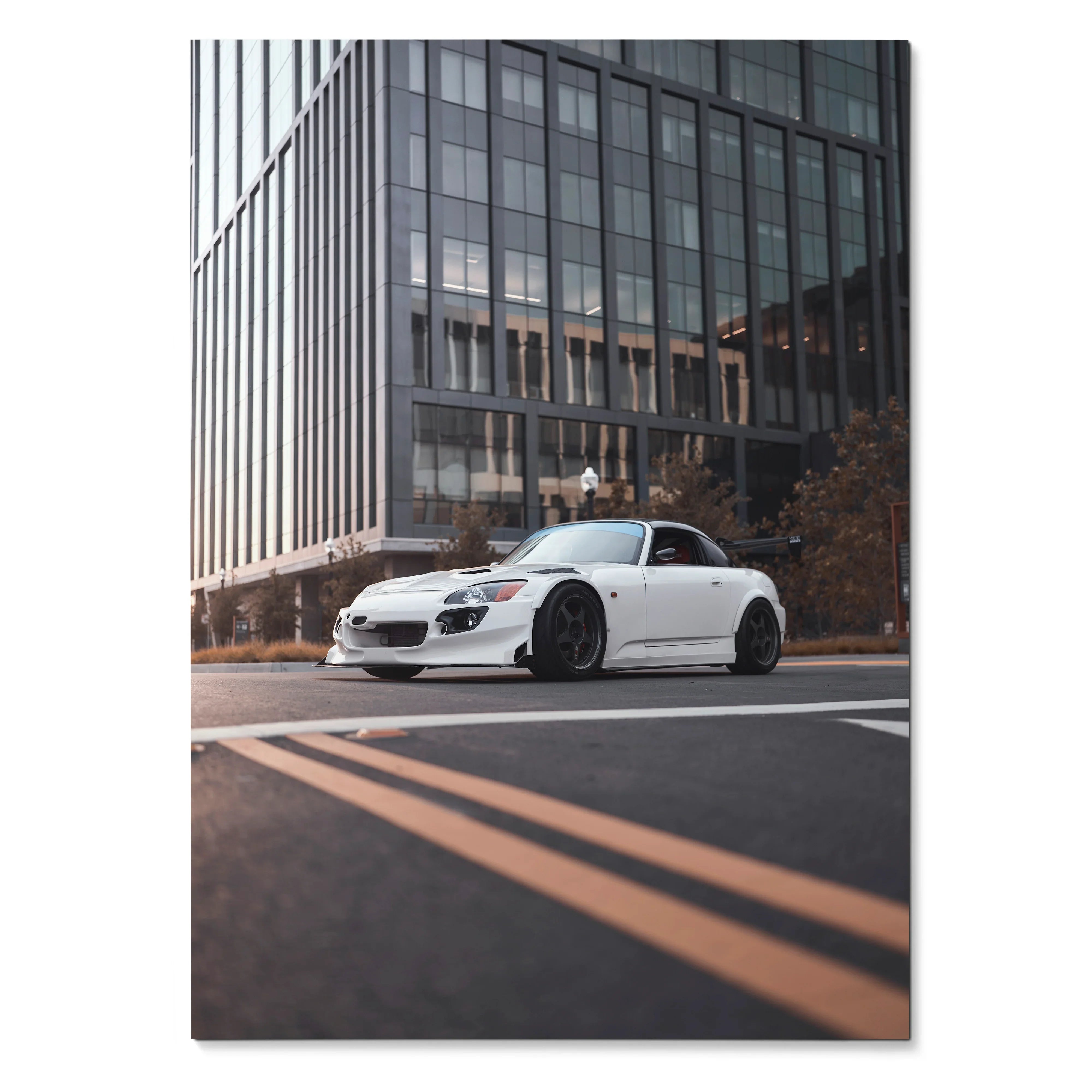 Honda S2000 poster showing white sports car with lowered suspension on city street, wall art for enthusiasts.