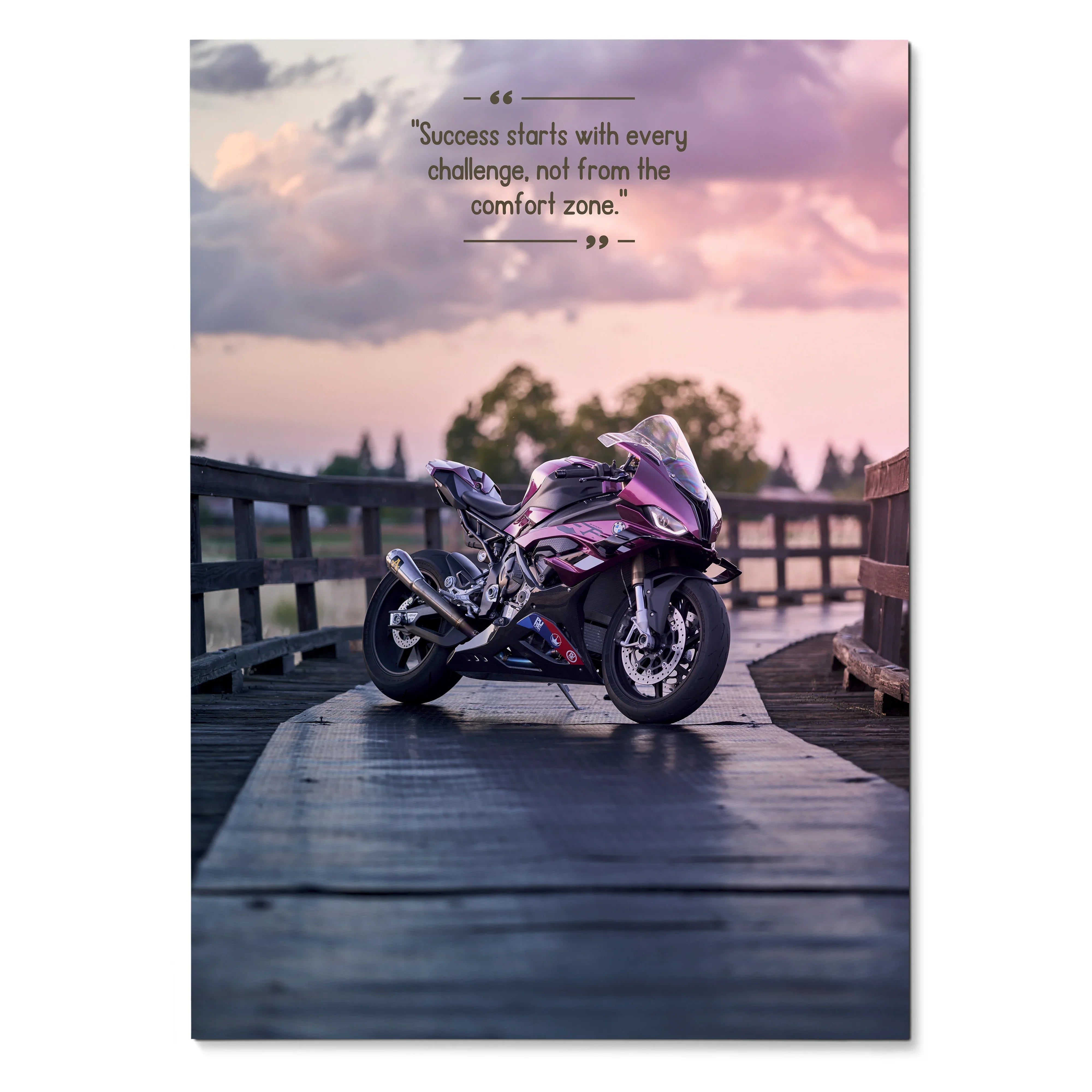 Motivational poster wall art featuring a pink BMW S1000RR motorcycle on wooden bridge at sunset with inspiring quote.
