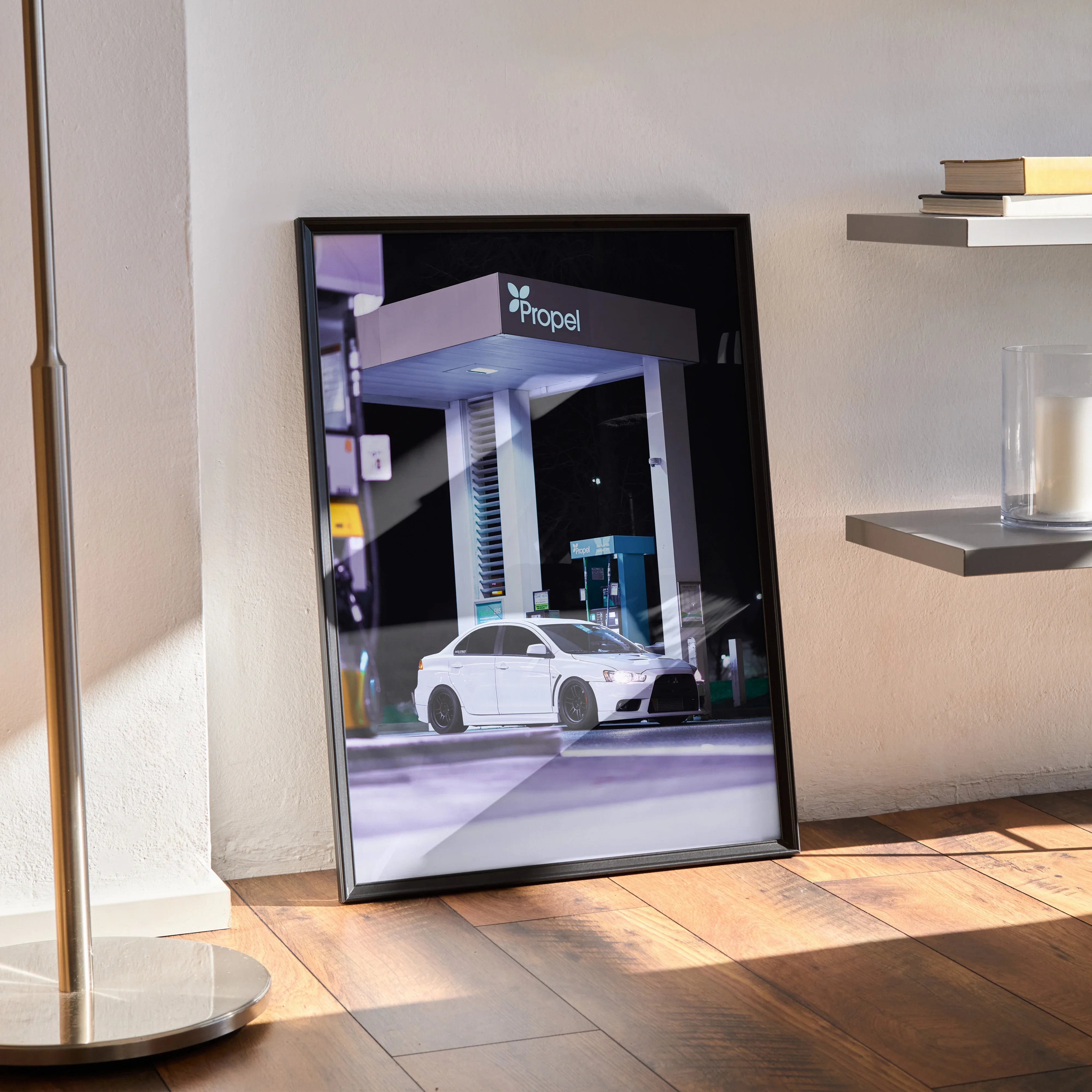 Mitsubishi Evo 10 high resolution poster in black frame leaning on wall, modern car wall art.