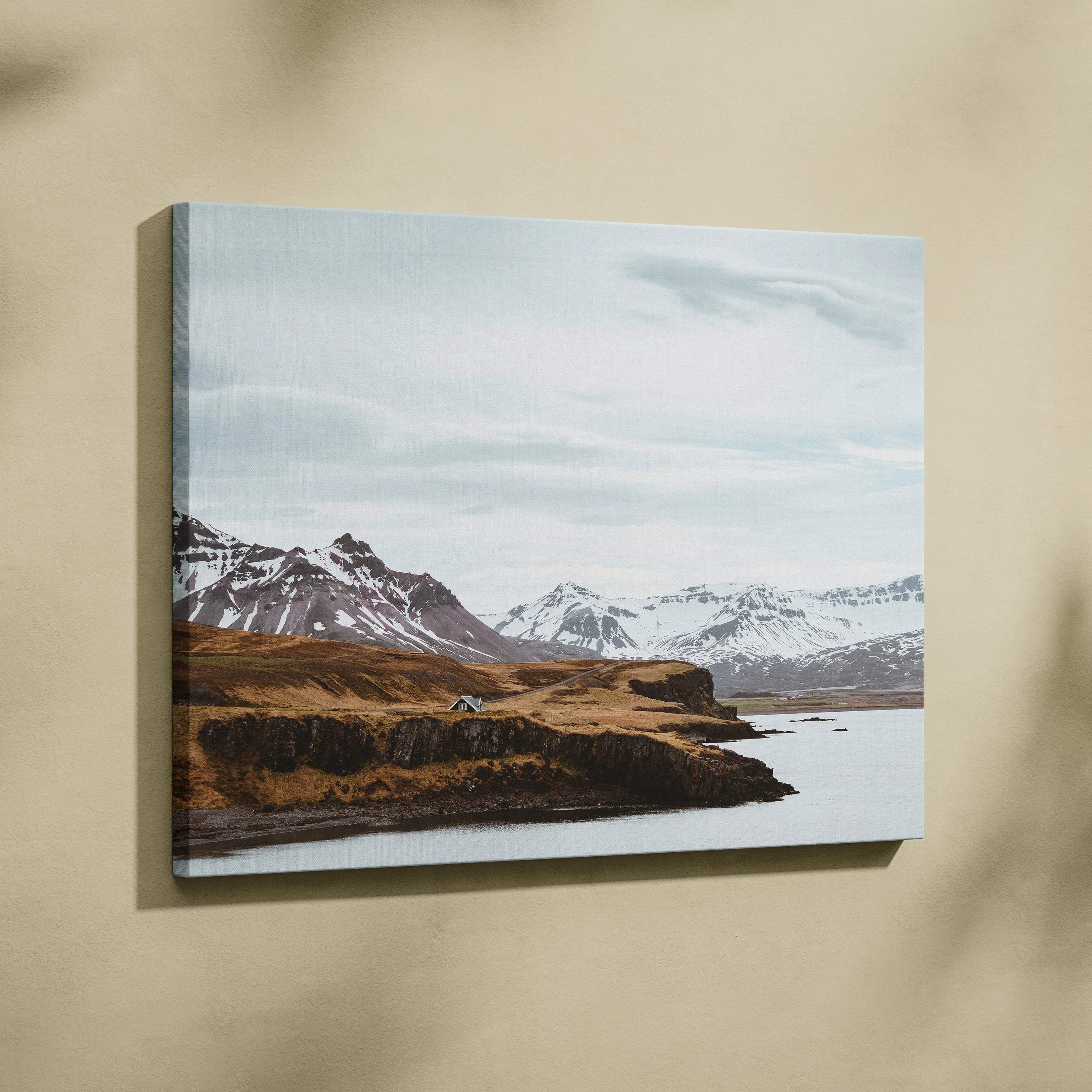 Canvas print of Nordic Icelandic snowy mountain coastline in serene blue tones